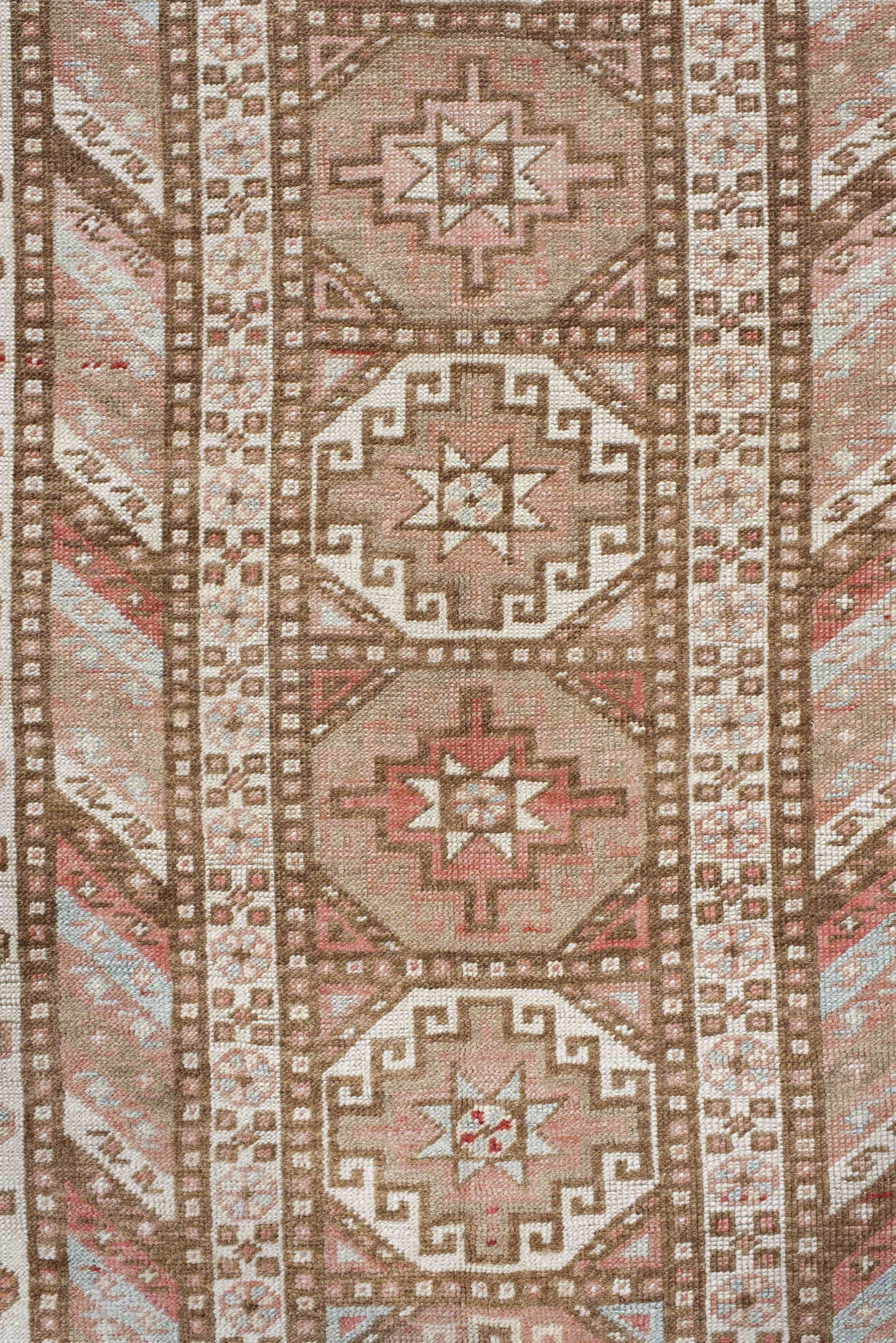 4' x 10' one-of-a-kind handmade antique Caucasian runner rug. Color palette: ivory, taupe, rose, rust, camel, brown, beige