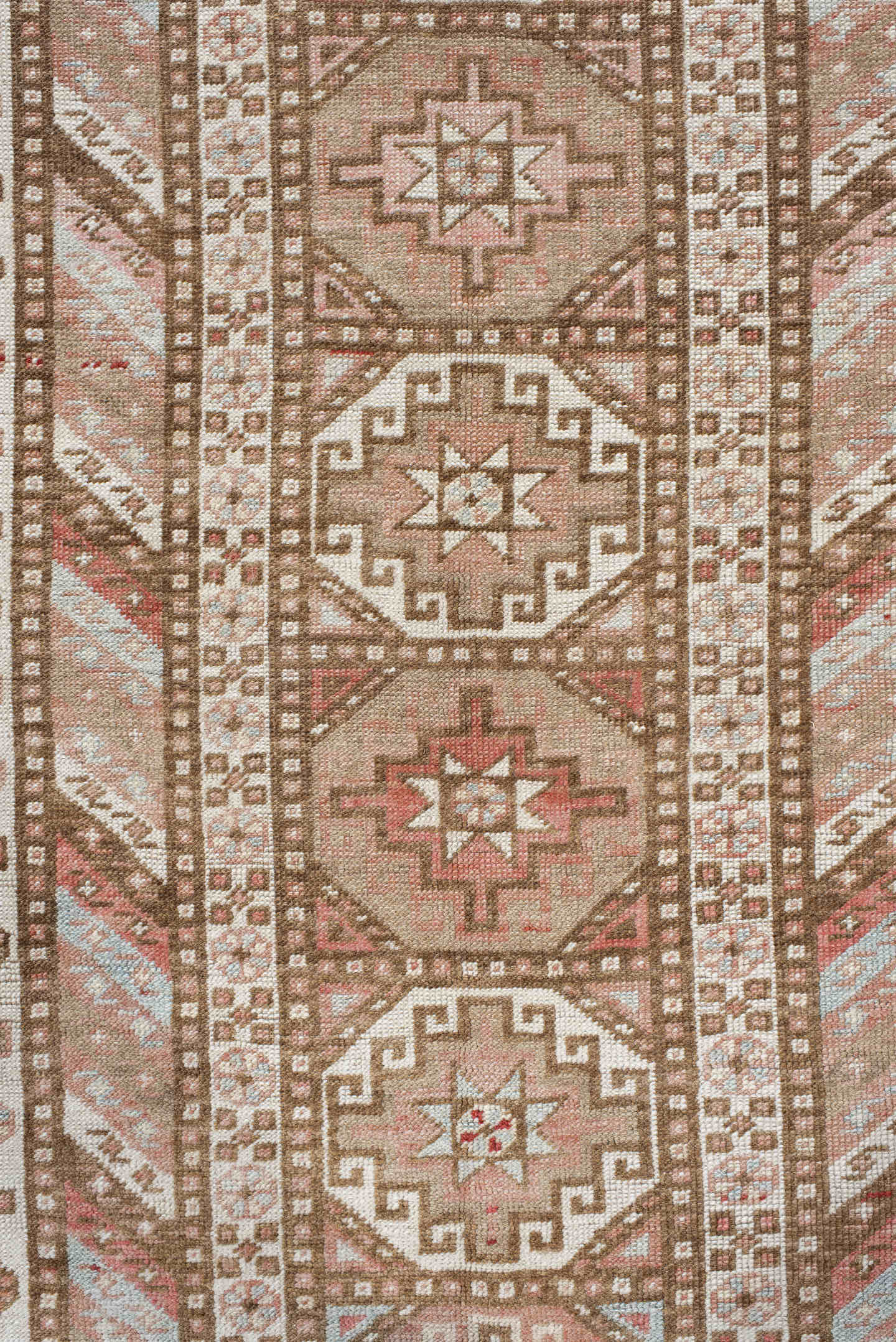 4' x 10' one-of-a-kind handmade antique Caucasian runner rug. Color palette: ivory, taupe, rose, rust, camel, brown, beige