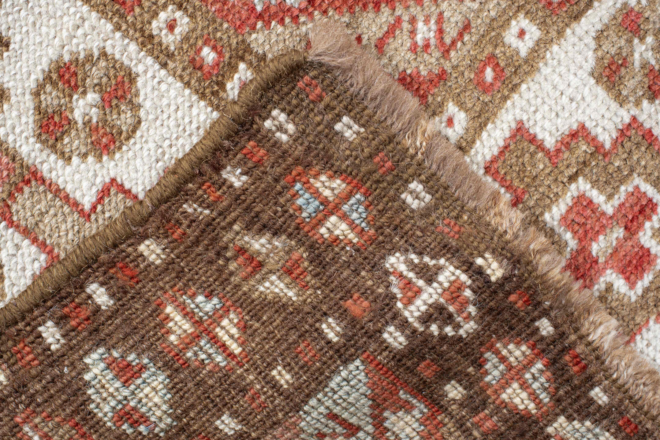 4' x 10' one-of-a-kind handmade antique Caucasian runner rug. Color palette: ivory, taupe, rose, rust, camel, brown, beige