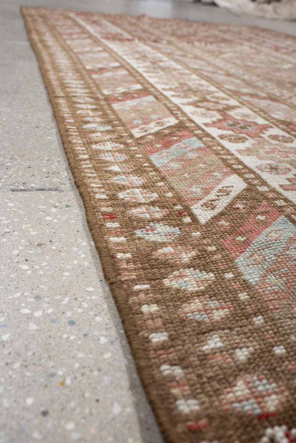 4' x 10' one-of-a-kind handmade antique Caucasian runner rug. Color palette: ivory, taupe, rose, rust, camel, brown, beige