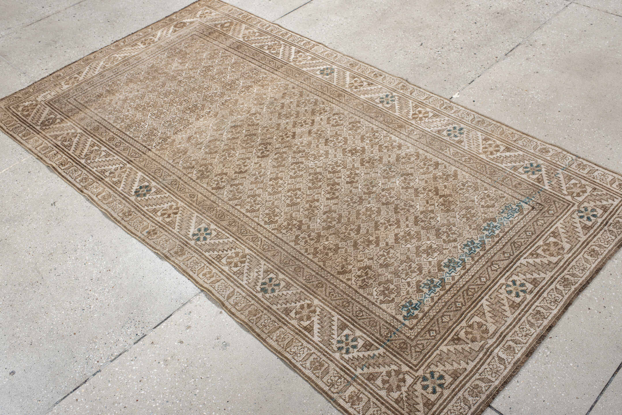 3' x 7' one-of-a-kind handmade vintage Belouch rug. Color palette: ivory, taupe, beige, camel, sky_blue, gray, light blue