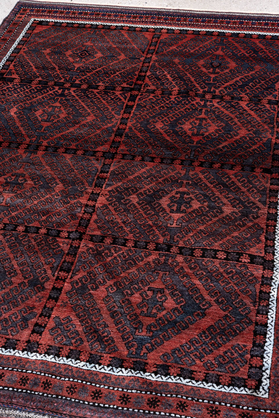 4' x 6' one-of-a-kind handmade vintage Belouch small size rug. Color palette: rust, navy, burgundy, ivory, charcoal