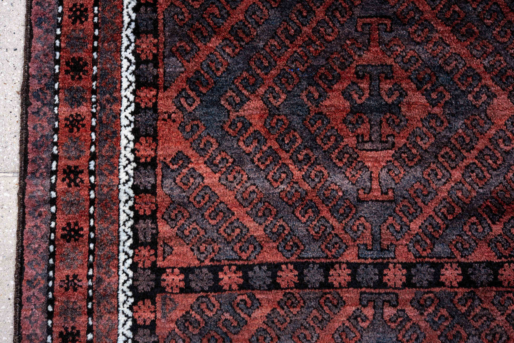 4' x 6' one-of-a-kind handmade vintage Belouch small size rug. Color palette: rust, navy, burgundy, ivory, charcoal