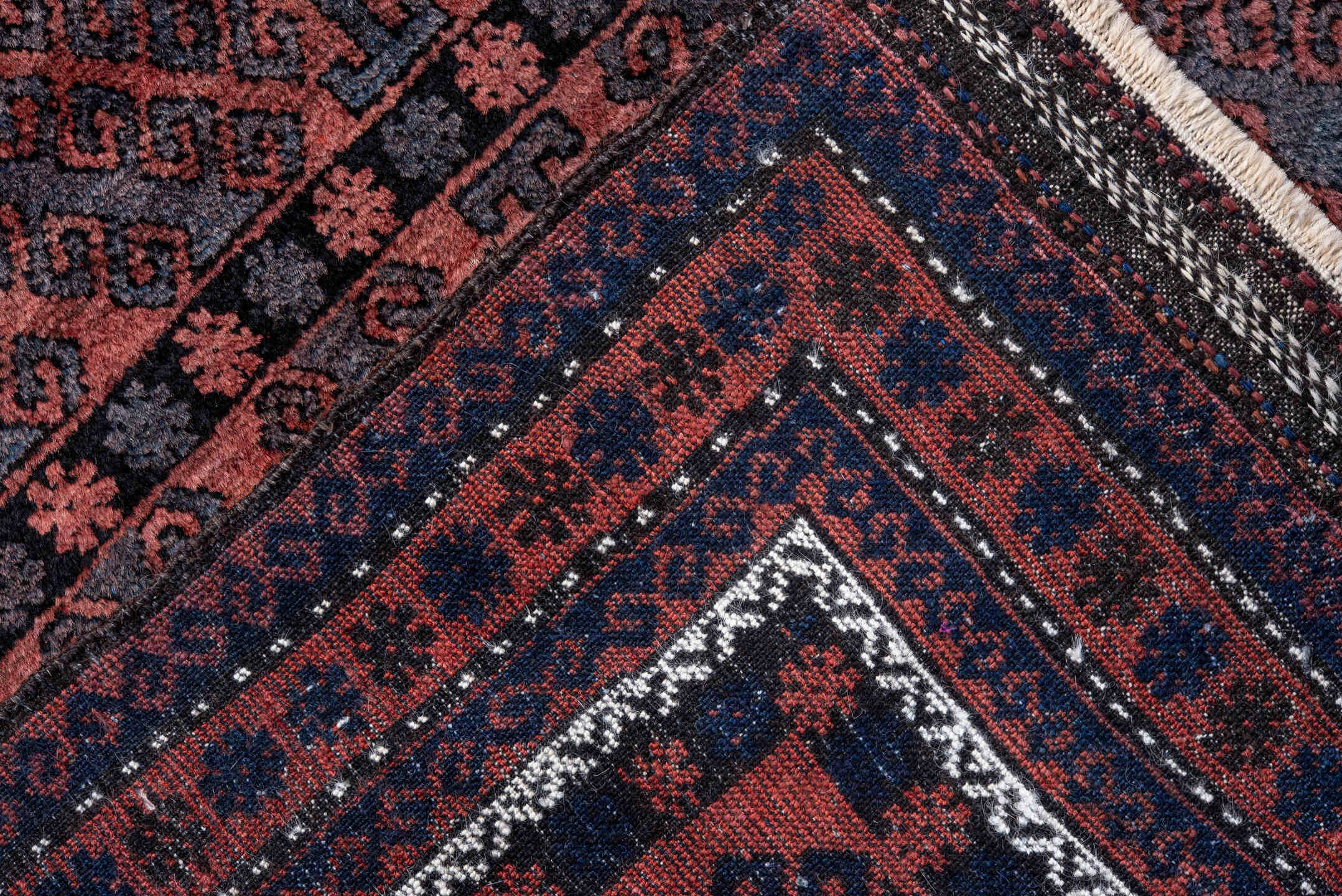 4' x 6' one-of-a-kind handmade vintage Belouch small size rug. Color palette: rust, navy, burgundy, ivory, charcoal