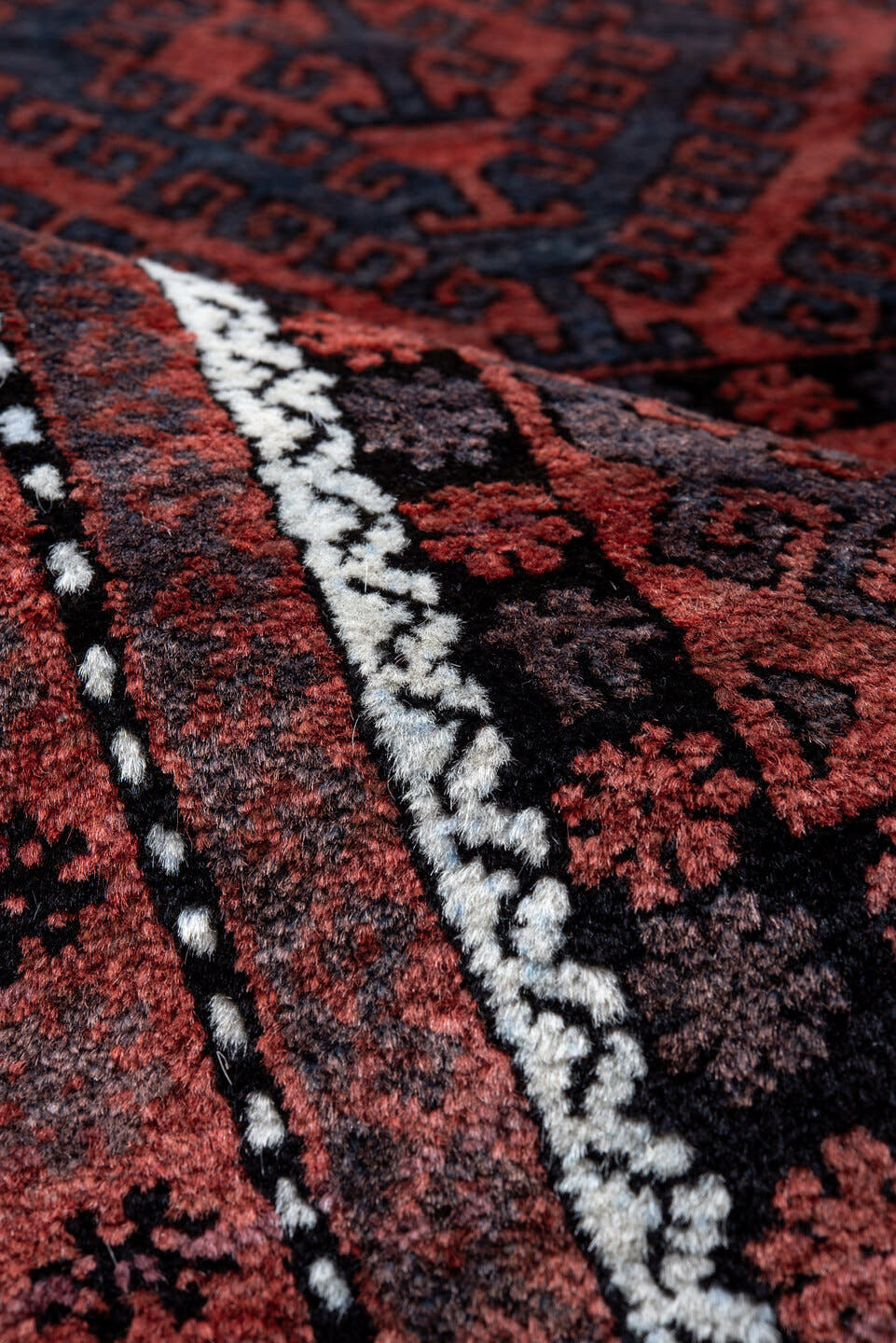 4' x 6' one-of-a-kind handmade vintage Belouch small size rug. Color palette: rust, navy, burgundy, ivory, charcoal