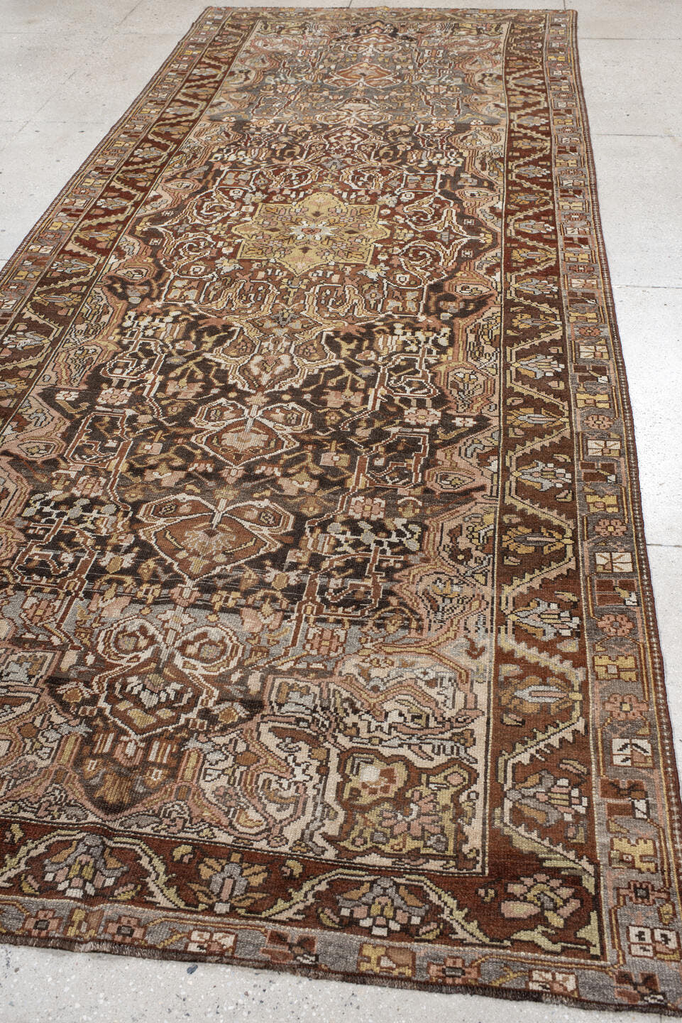 5' x 13' one-of-a-kind handmade vintage Baktiary rug. Color palette: brown, ivory, taupe, camel, charcoal, rust, sage, rose