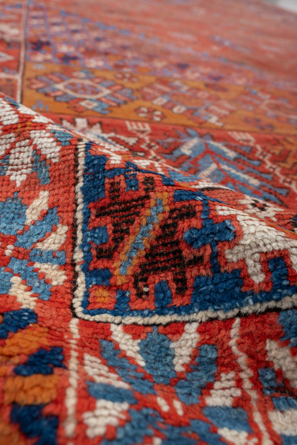 7' x 19' one-of-a-kind handmade vintage Marina rug. Color palette: terracotta, rust, indigo, ivory, sienna, navy, coral
