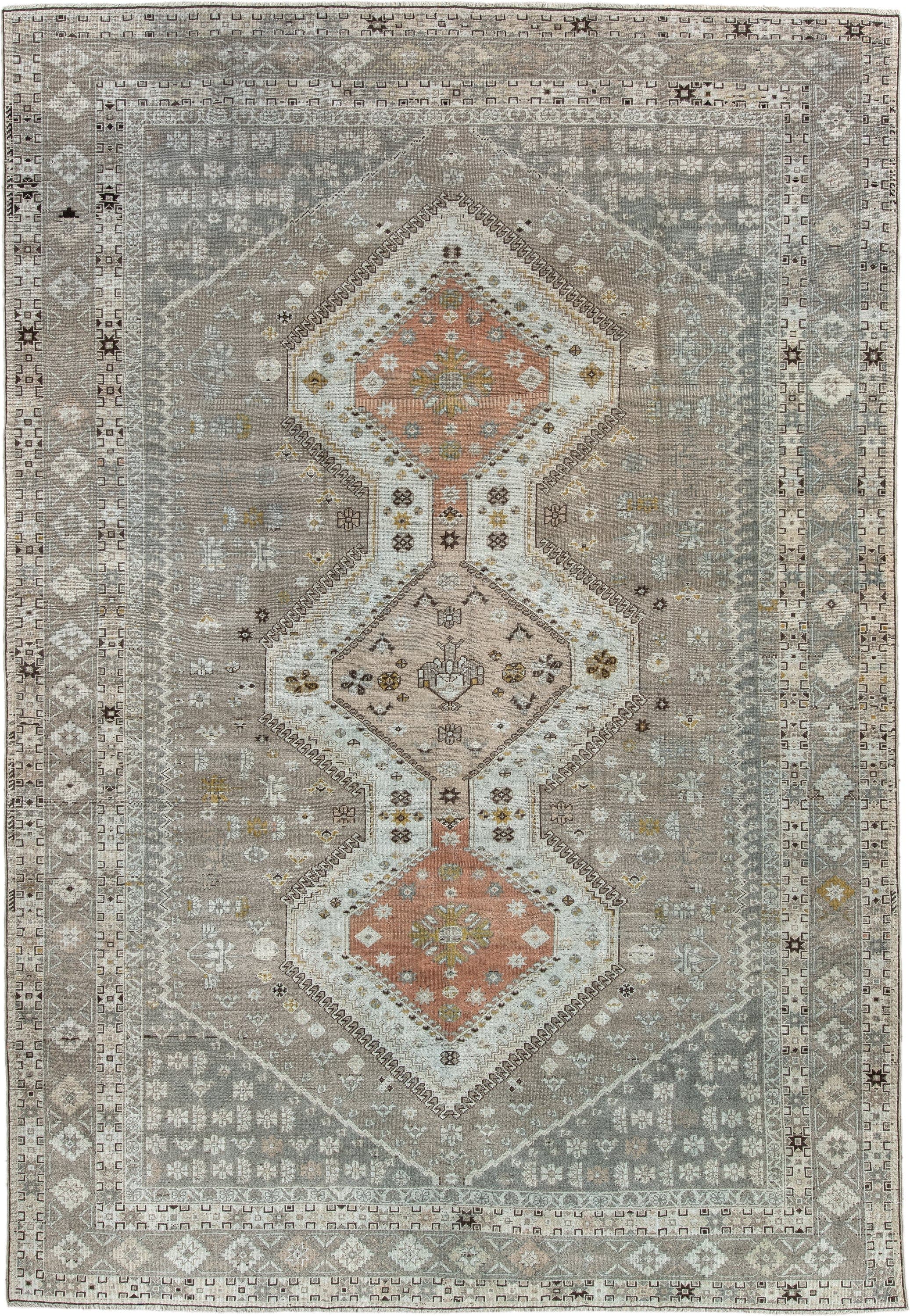 6' x 10' one-of-a-kind handmade antique Qashqai large size rug. Color palette: taupe, ivory, camel, rose, gold, brown, cream