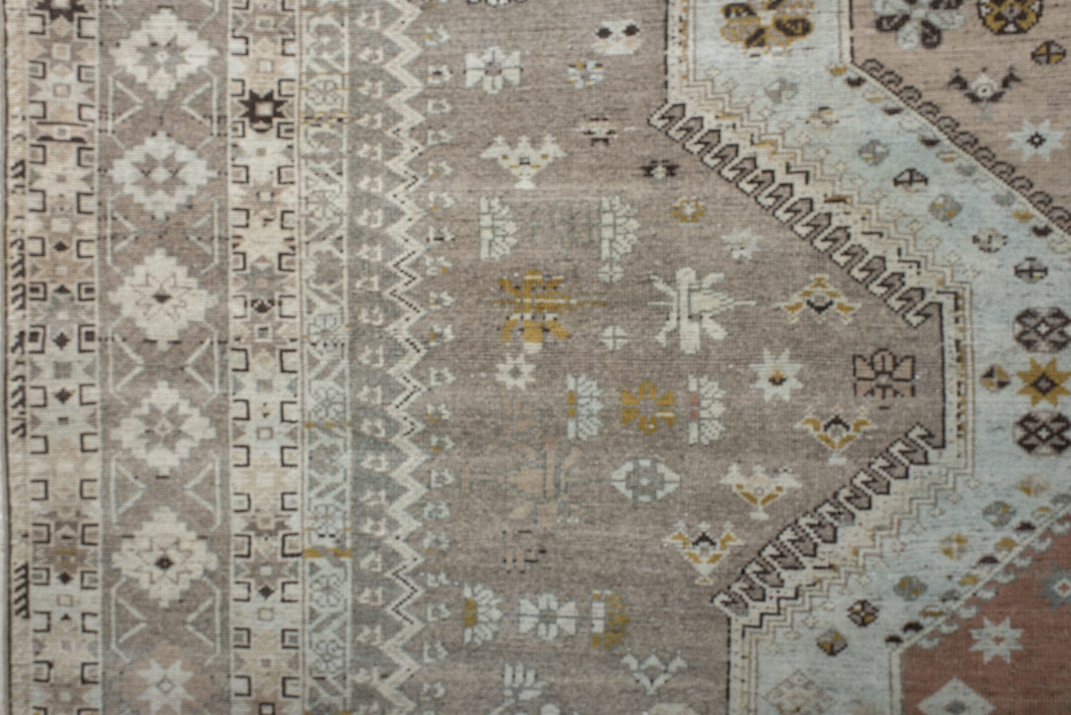 6' x 10' one-of-a-kind handmade antique Qashqai large size rug. Color palette: taupe, ivory, camel, rose, gold, brown, cream
