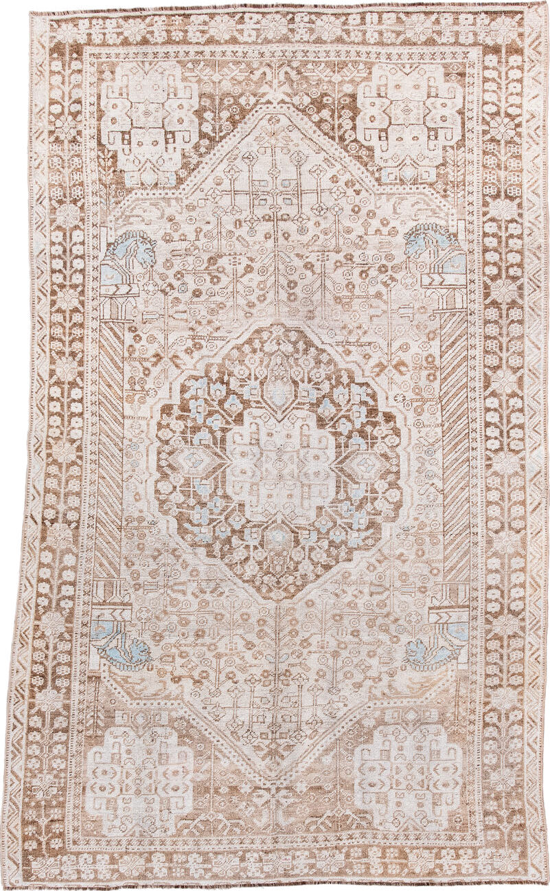 4' x 8' one-of-a-kind handmade antique Shiraz rug. Color palette: ivory, taupe, camel, pale blue, beige, light brown, gray