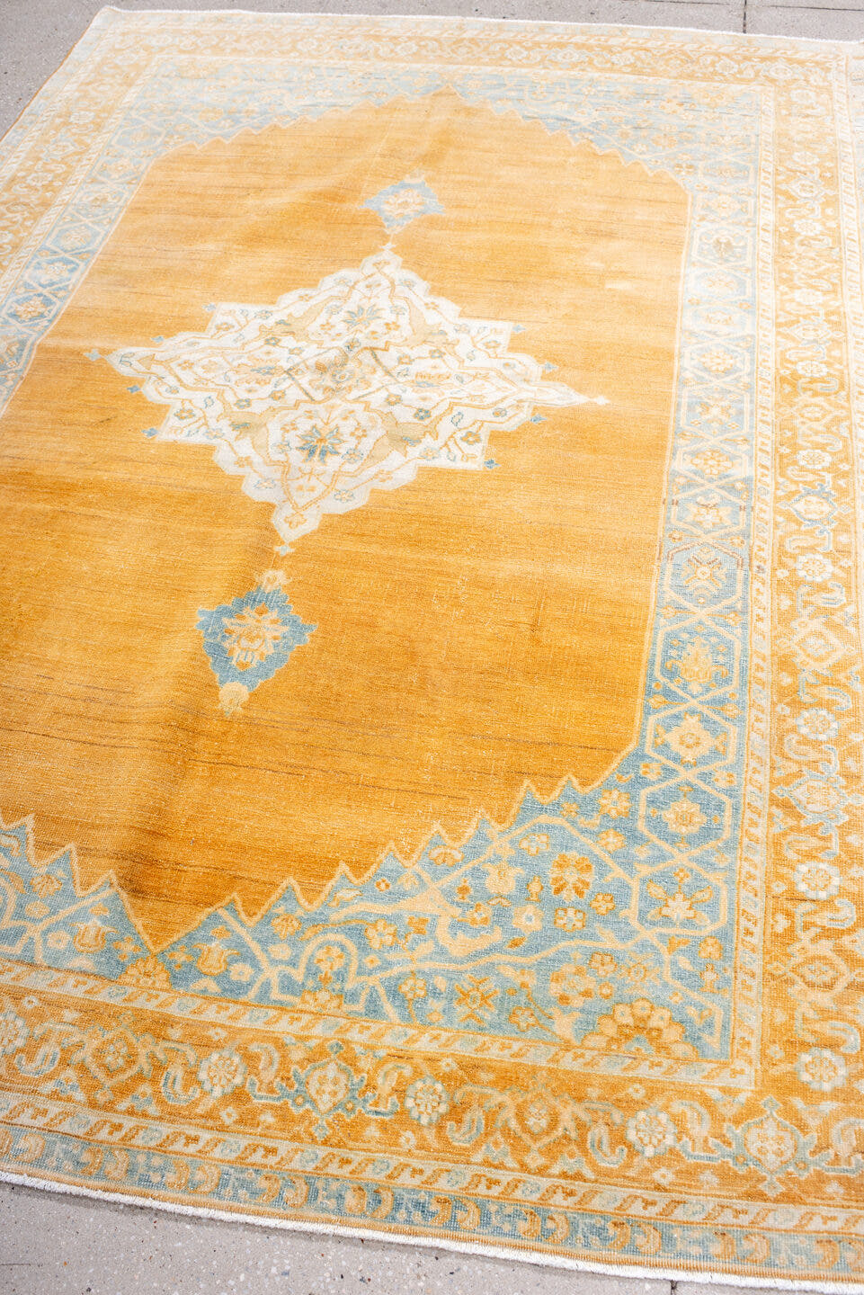 5' x 8' one-of-a-kind handmade antique Oushak medium size rug. Color palette: apricot, pale blue, ivory, cream, gold, camel