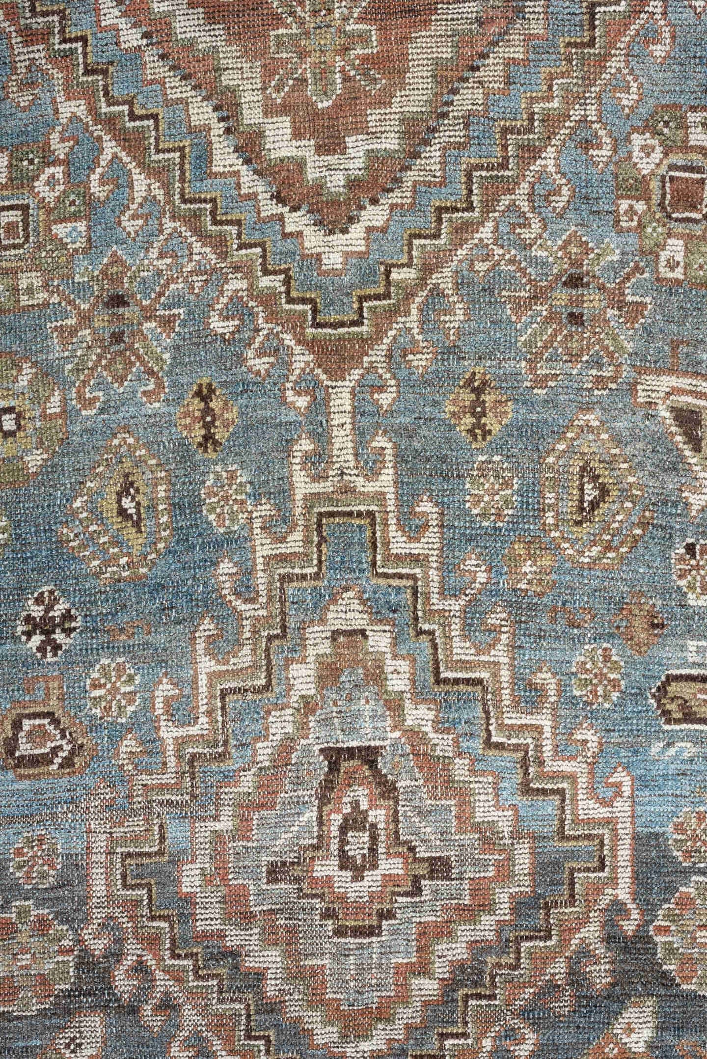 5' x 10' one-of-a-kind handmade vintage Shiraz runner rug. Color palette: sky blue, rust, ivory, brown, camel, charcoal