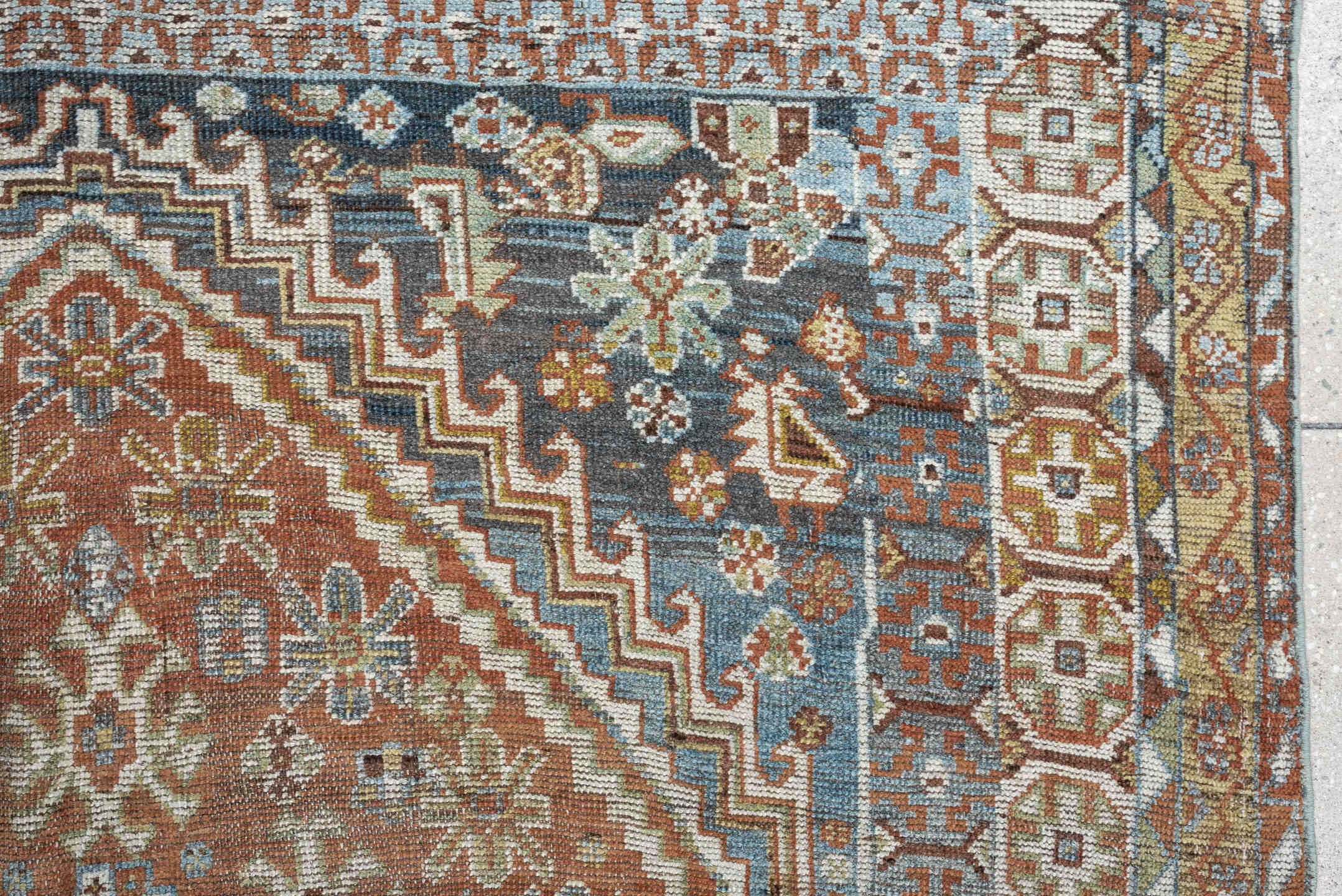 5' x 10' one-of-a-kind handmade vintage Shiraz runner rug. Color palette: sky blue, rust, ivory, brown, camel, charcoal