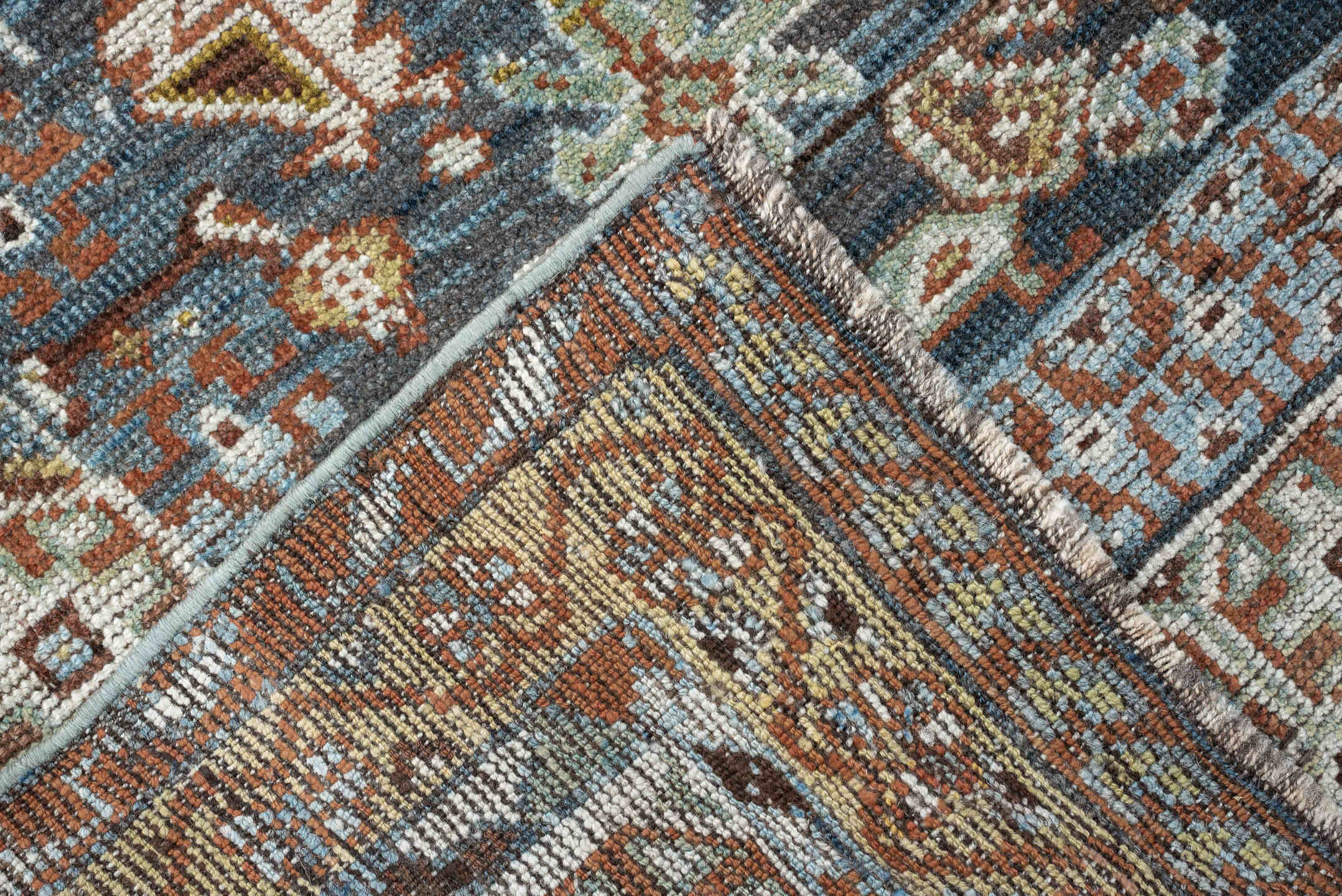 5' x 10' one-of-a-kind handmade vintage Shiraz runner rug. Color palette: sky blue, rust, ivory, brown, camel, charcoal
