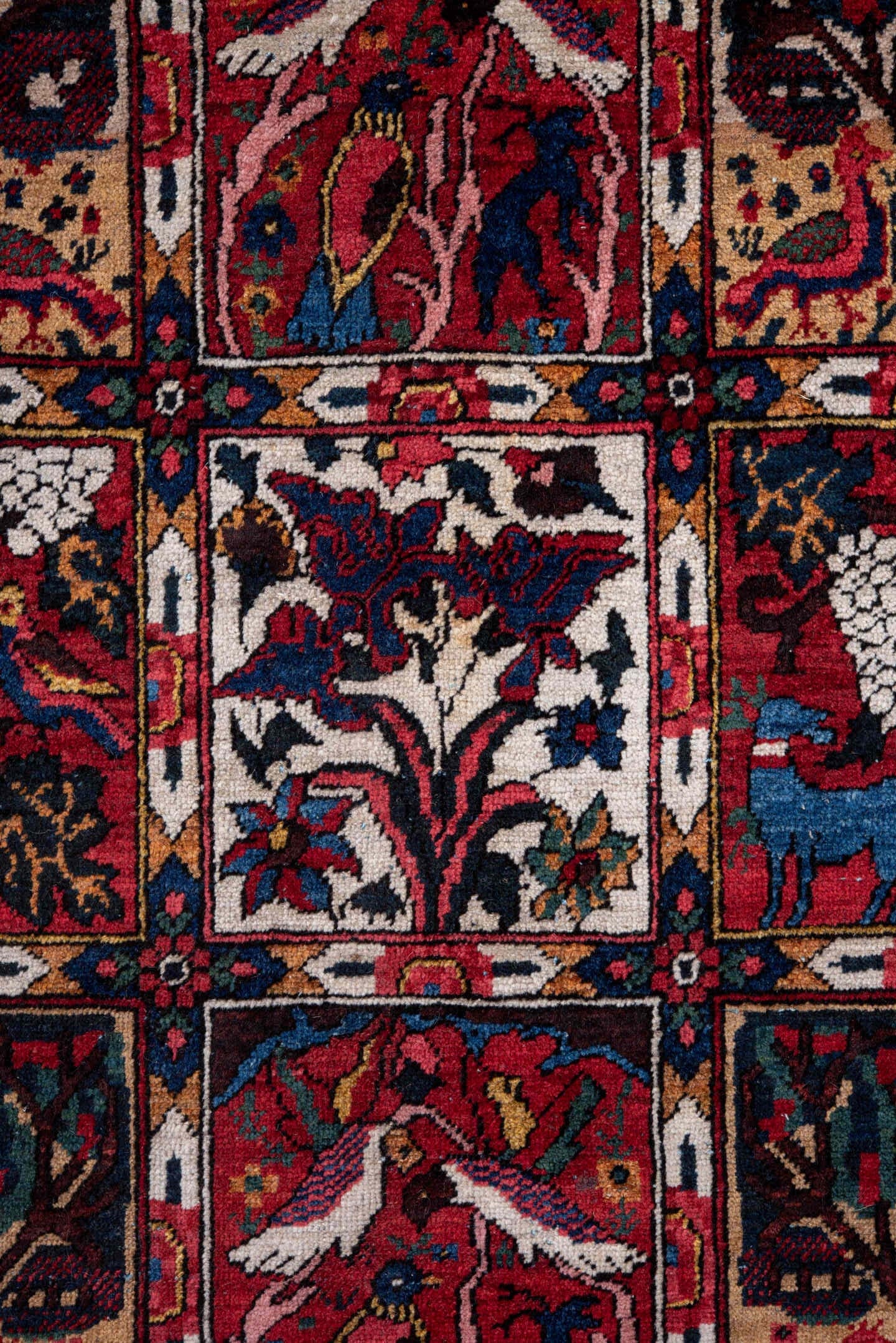 5' x 8' one-of-a-kind handmade antique Baktiary medium size rug. Color palette: red, navy, ivory, burgundy, cobalt, camel