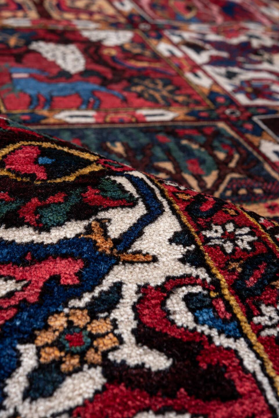 5' x 8' one-of-a-kind handmade antique Baktiary medium size rug. Color palette: red, navy, ivory, burgundy, cobalt, camel
