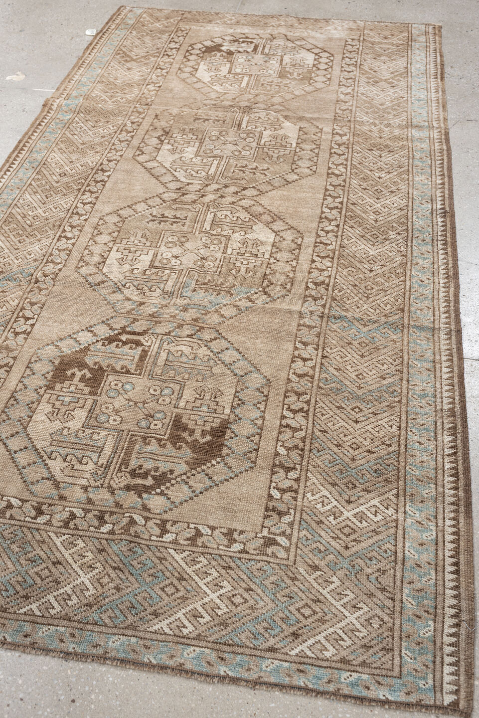 7' x 4' one-of-a-kind handmade vintage Afghan rug. Color palette: ivory, camel, taupe, light blue, brown, beige, gray