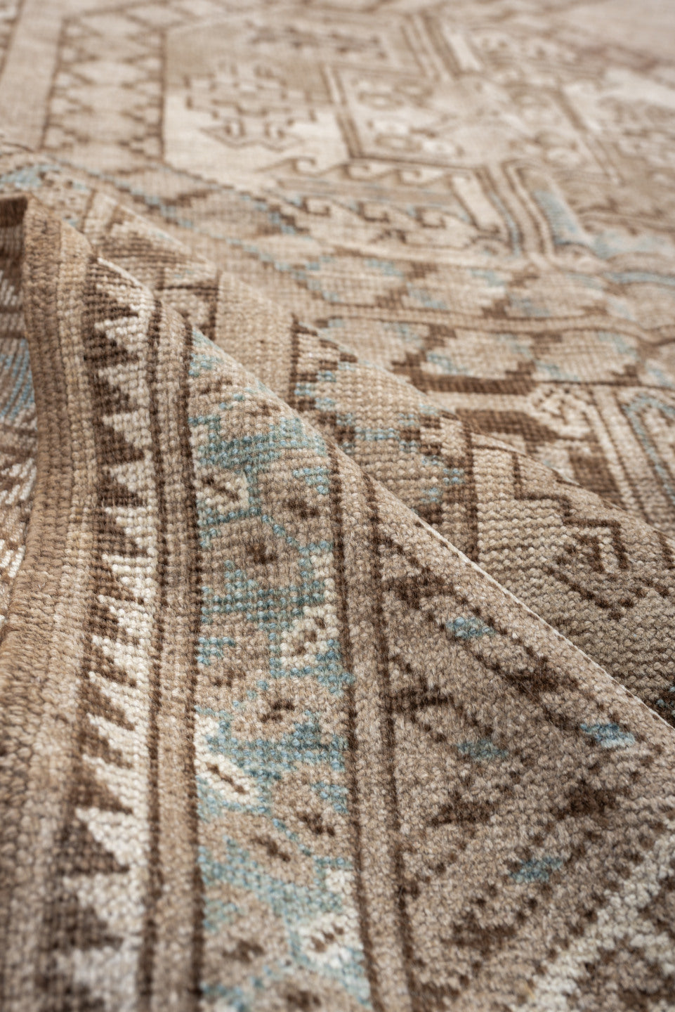 7' x 4' one-of-a-kind handmade vintage Afghan rug. Color palette: ivory, camel, taupe, light blue, brown, beige, gray