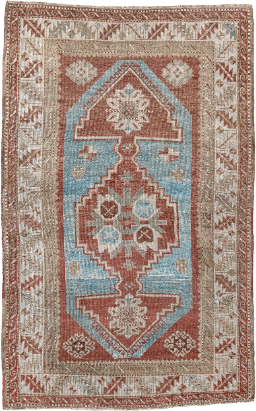 6' x 4' one-of-a-kind handmade antique Caucasian rug. Color palette: terracotta, ivory, sky blue, taupe, camel, brown