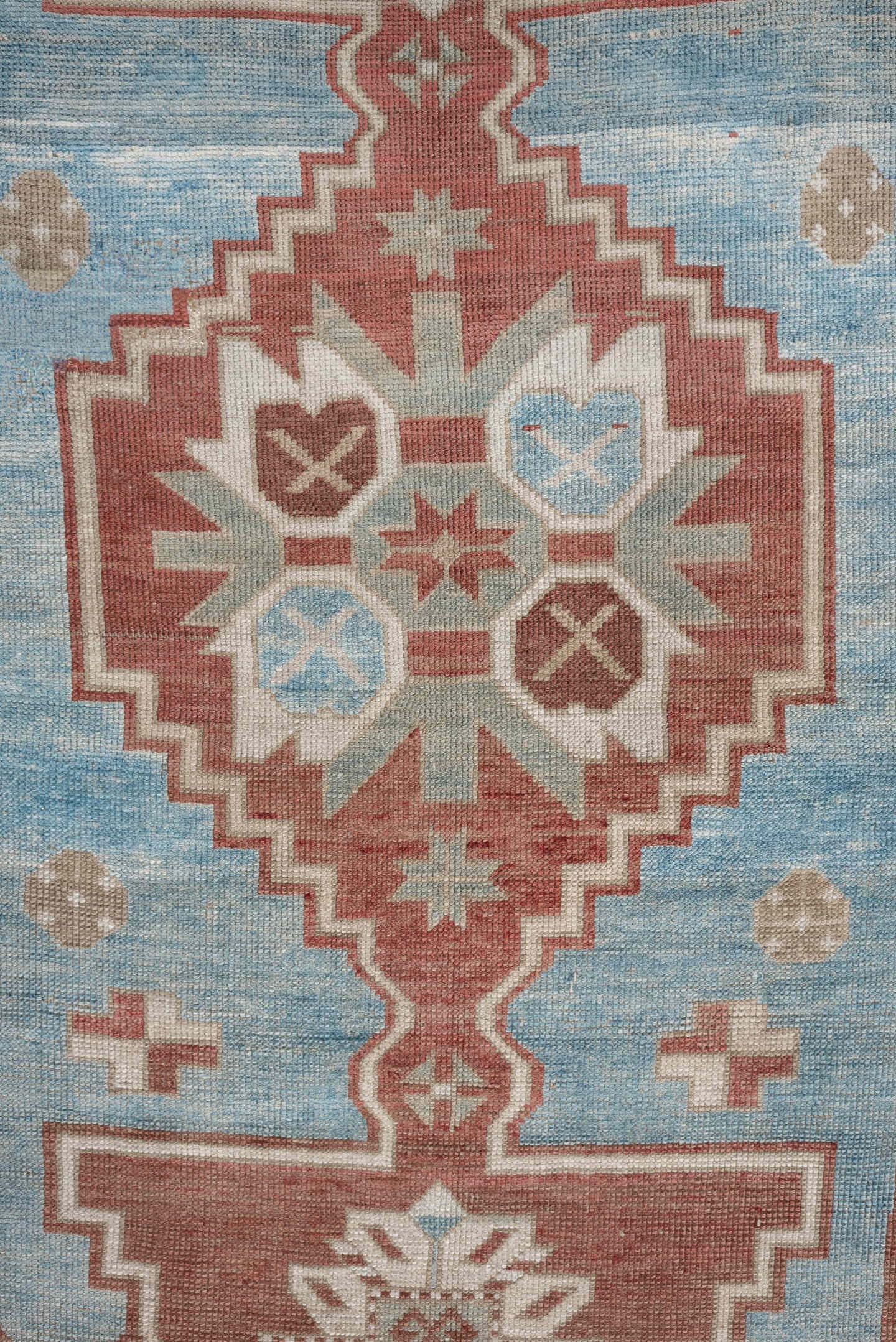 6' x 4' one-of-a-kind handmade antique Caucasian rug. Color palette: terracotta, ivory, sky blue, taupe, camel, brown