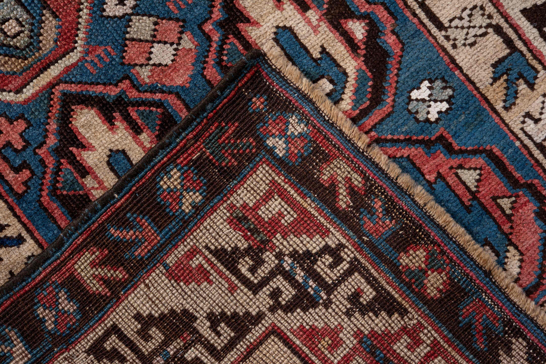 2' x 4' one-of-a-kind handmade vintage Caucasian small size rug. Color palette: blue, ivory, rust, brown, navy, pink, black