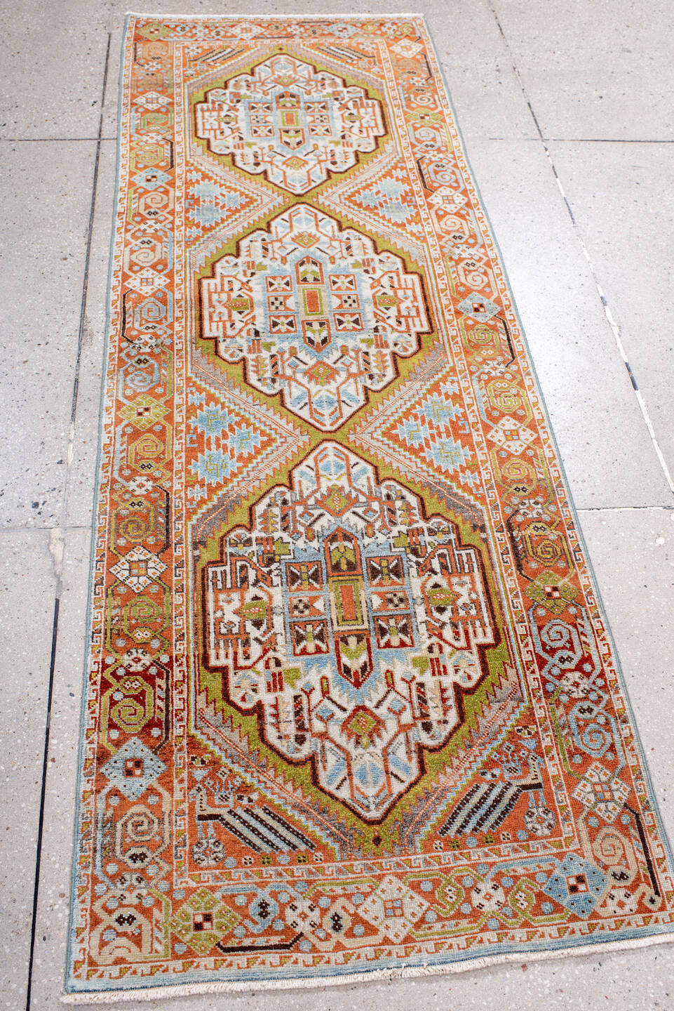 2' x 6' one-of-a-kind handmade vintage Afshar runner rug. Color palette: terra cotta, ivory, sky blue, olive, rust, charcoal