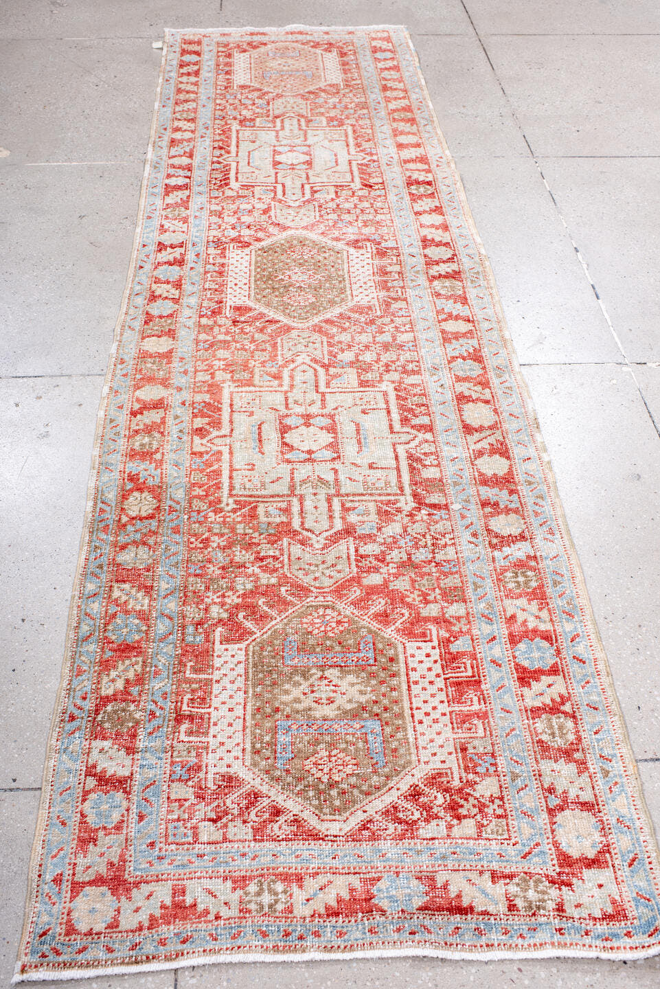 2' x 10' one-of-a-kind handmade antique Karaje runner rug. Color palette: rust, ivory, pale blue, camel, terracotta, taupe