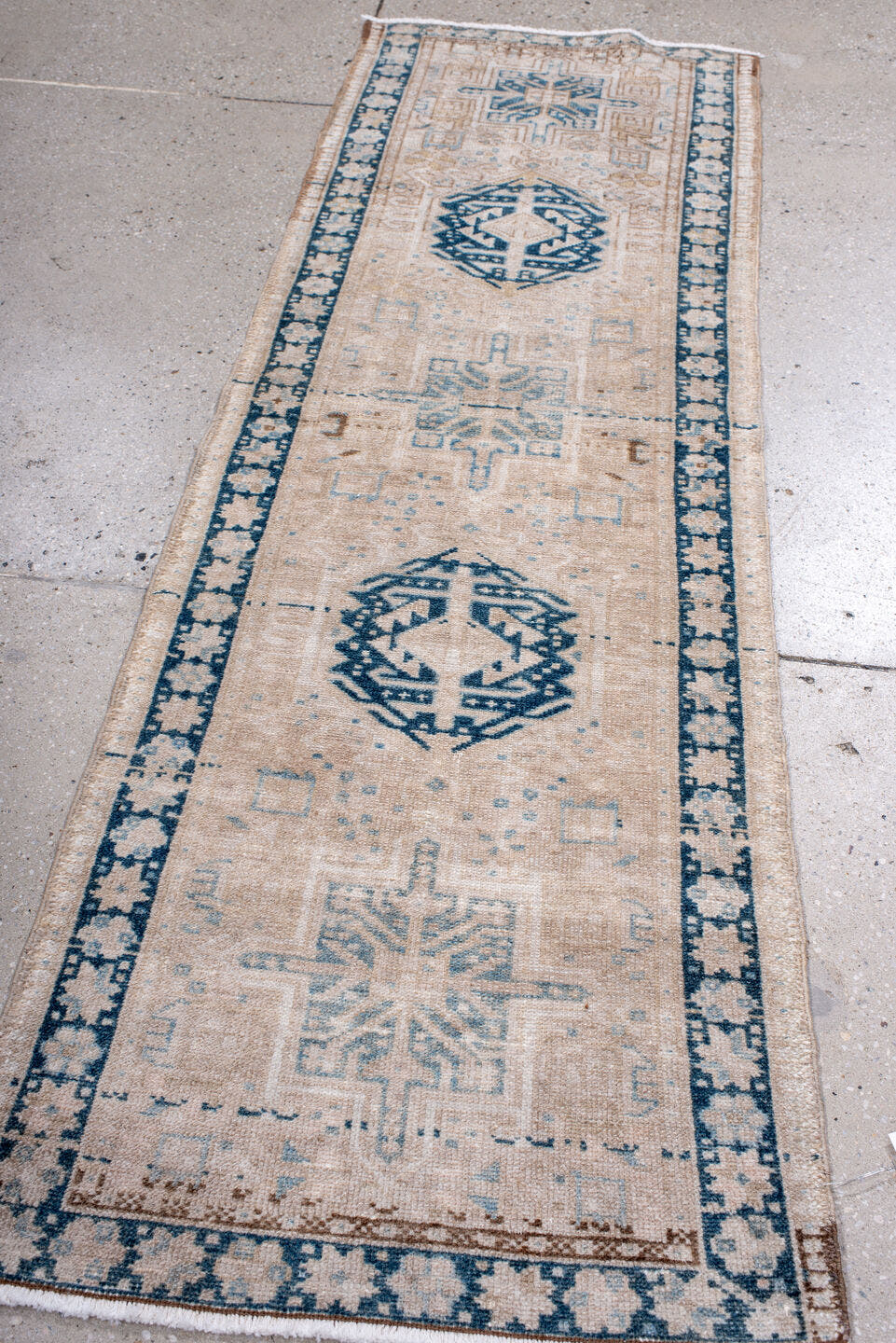 2' x 6' one-of-a-kind handmade antique Karaje runner rug. Color palette: ivory, sky blue, indigo, camel, taupe, brown