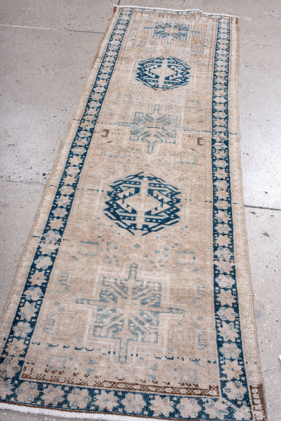 2' x 6' one-of-a-kind handmade antique Karaje runner rug. Color palette: ivory, sky blue, indigo, camel, taupe, brown