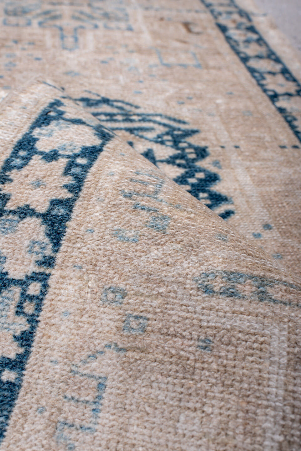 2' x 6' one-of-a-kind handmade antique Karaje runner rug. Color palette: ivory, sky blue, indigo, camel, taupe, brown