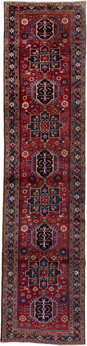 2' x 11' one-of-a-kind handmade vintage Heriz runner rug. Color palette: red, navy, ivory, sky blue, rust, camel, charcoal