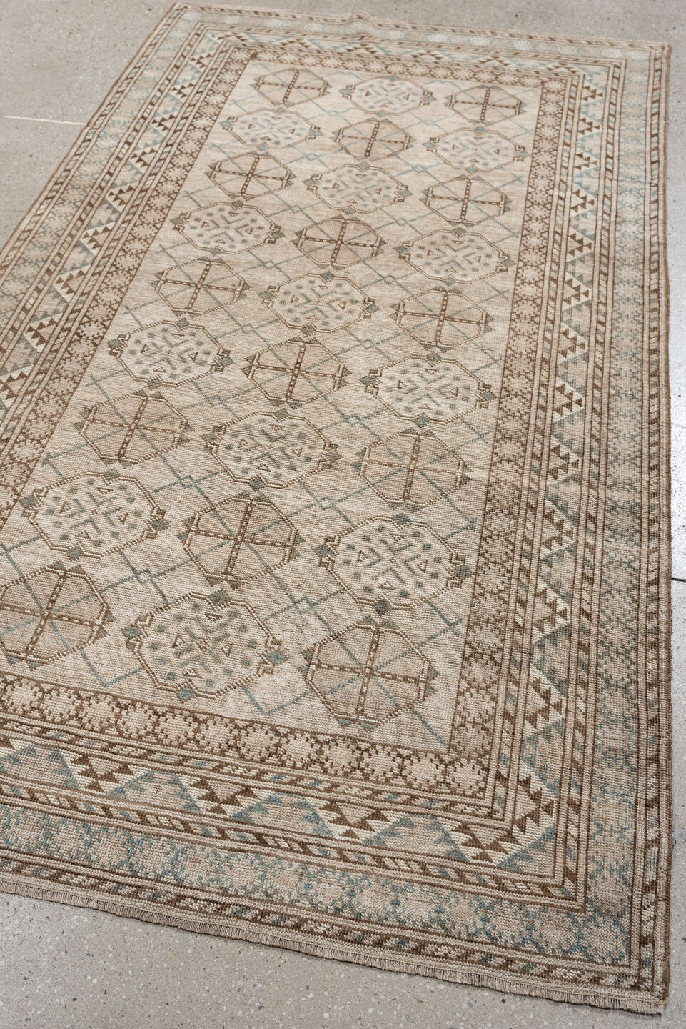 6' x 3' one-of-a-kind handmade antique Afghan rug. Color palette: ivory, taupe, pale blue, beige, camel, light brown, gray