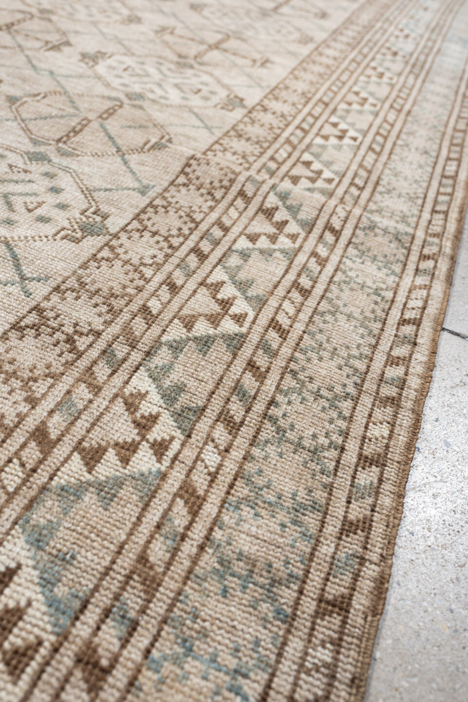 6' x 3' one-of-a-kind handmade antique Afghan rug. Color palette: ivory, taupe, pale blue, beige, camel, light brown, gray