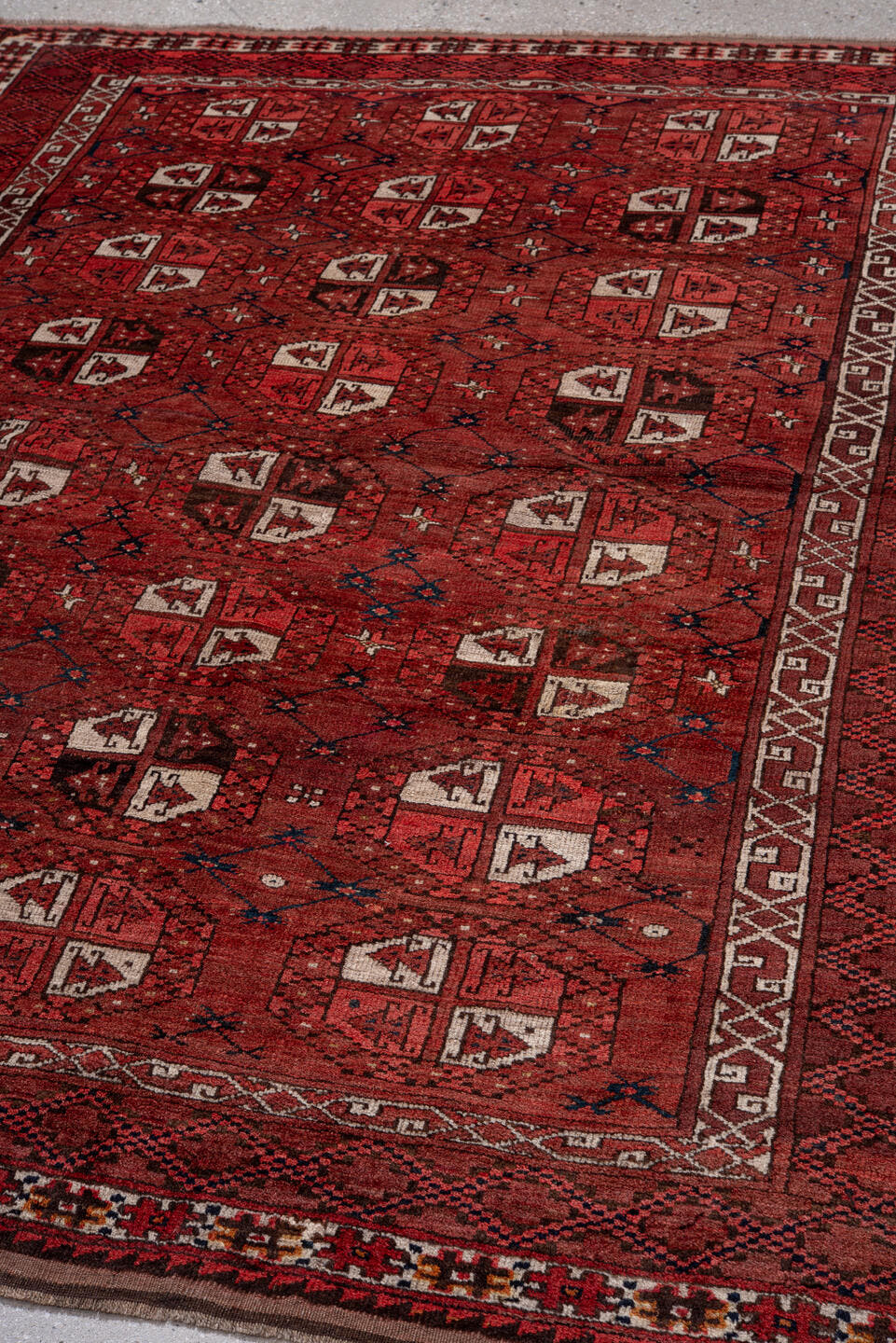 5' x 7' one-of-a-kind handmade vintage Afghan rug. Color palette: red, burgundy, ivory, brown, charcoal, navy, gray, black