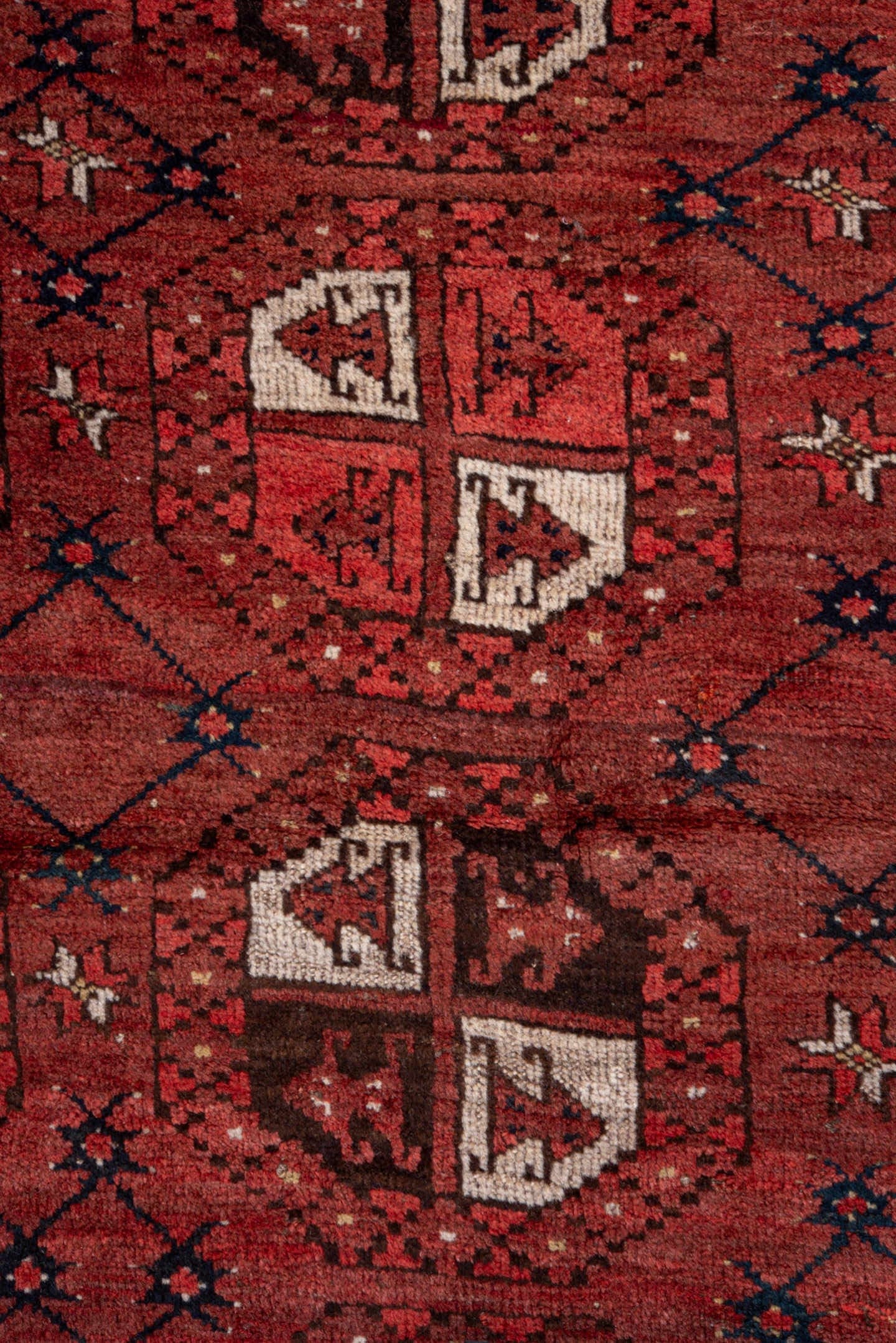 5' x 7' one-of-a-kind handmade vintage Afghan rug. Color palette: red, burgundy, ivory, brown, charcoal, navy, gray, black
