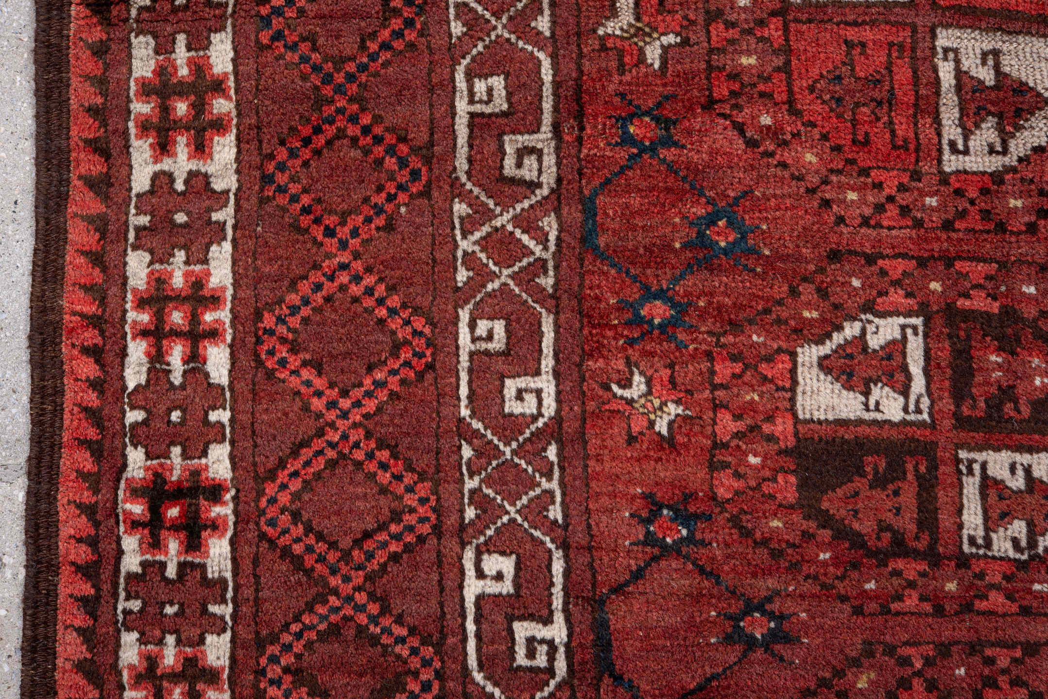 5' x 7' one-of-a-kind handmade vintage Afghan rug. Color palette: red, burgundy, ivory, brown, charcoal, navy, gray, black