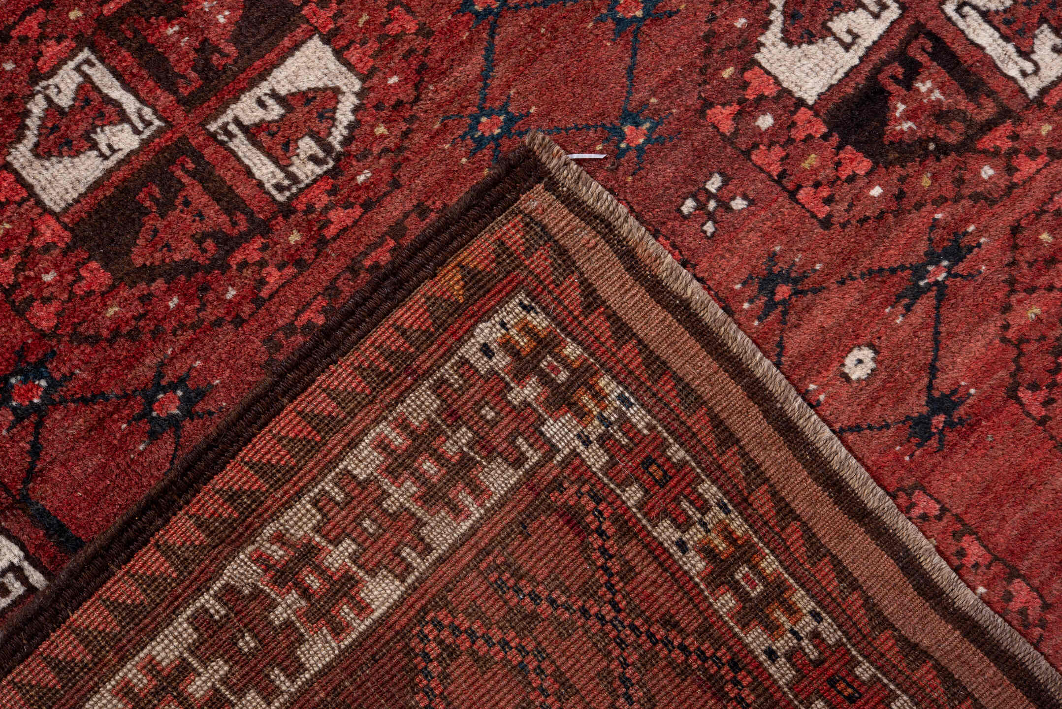5' x 7' one-of-a-kind handmade vintage Afghan rug. Color palette: red, burgundy, ivory, brown, charcoal, navy, gray, black