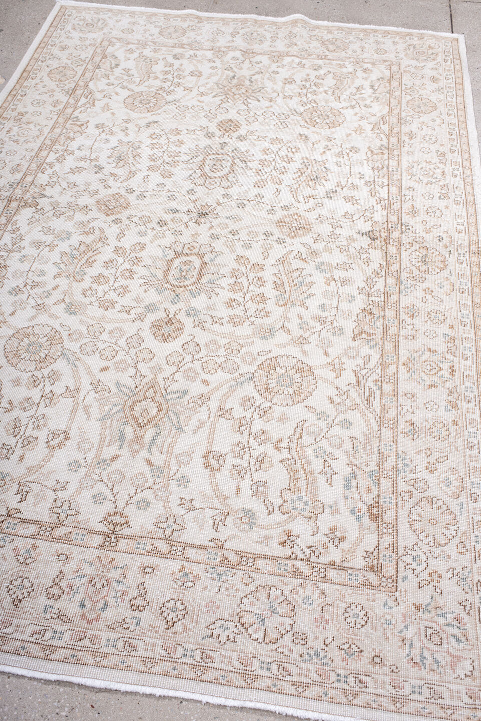 5' x 7' one-of-a-kind handmade antique Sparta rug. Color palette: ivory, beige, taupe, camel, pale blue, sand, gray
