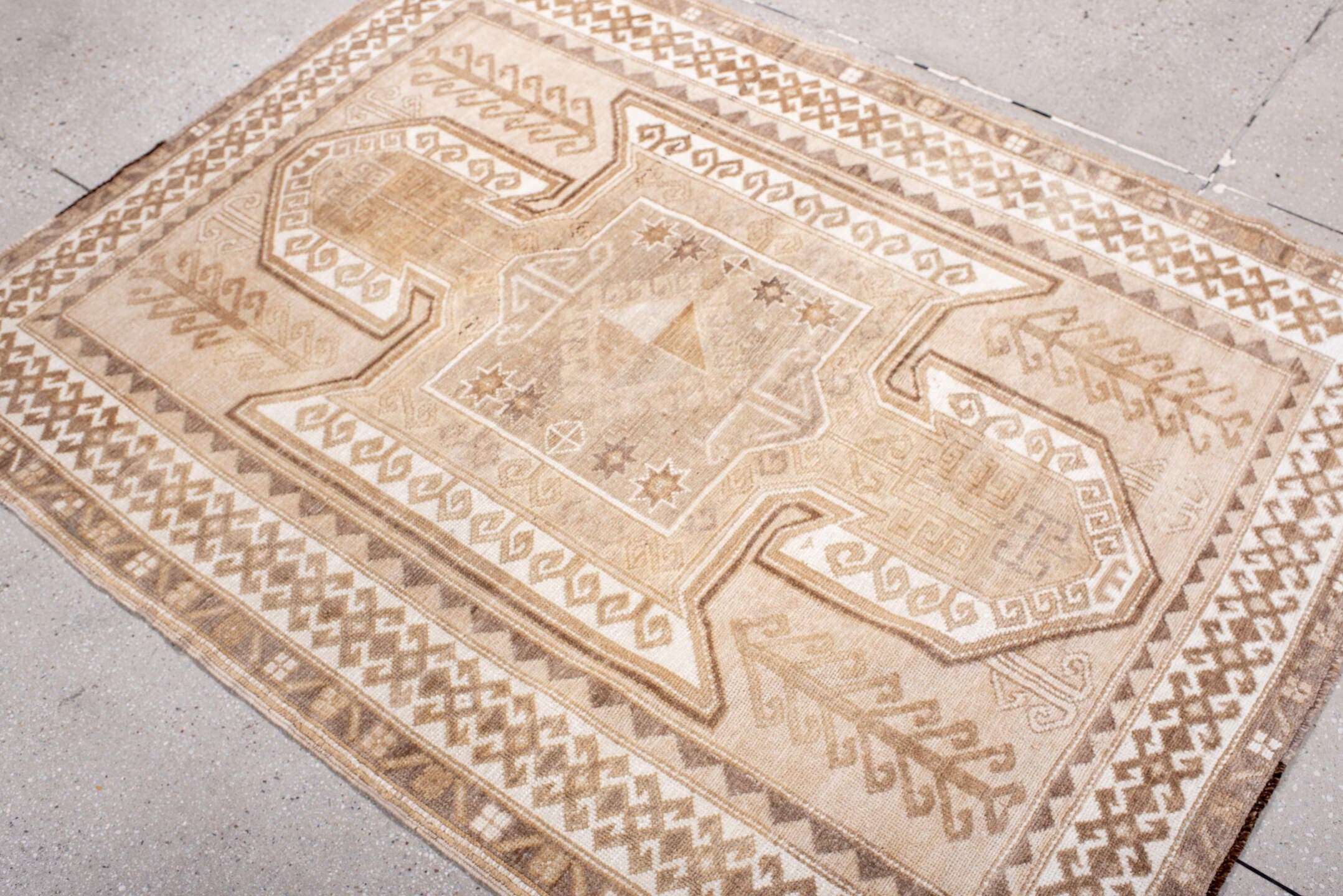4' x 5' one-of-a-kind handmade antique Kars small size rug. Color palette: ivory, taupe, camel, beige, sand, brown, gray