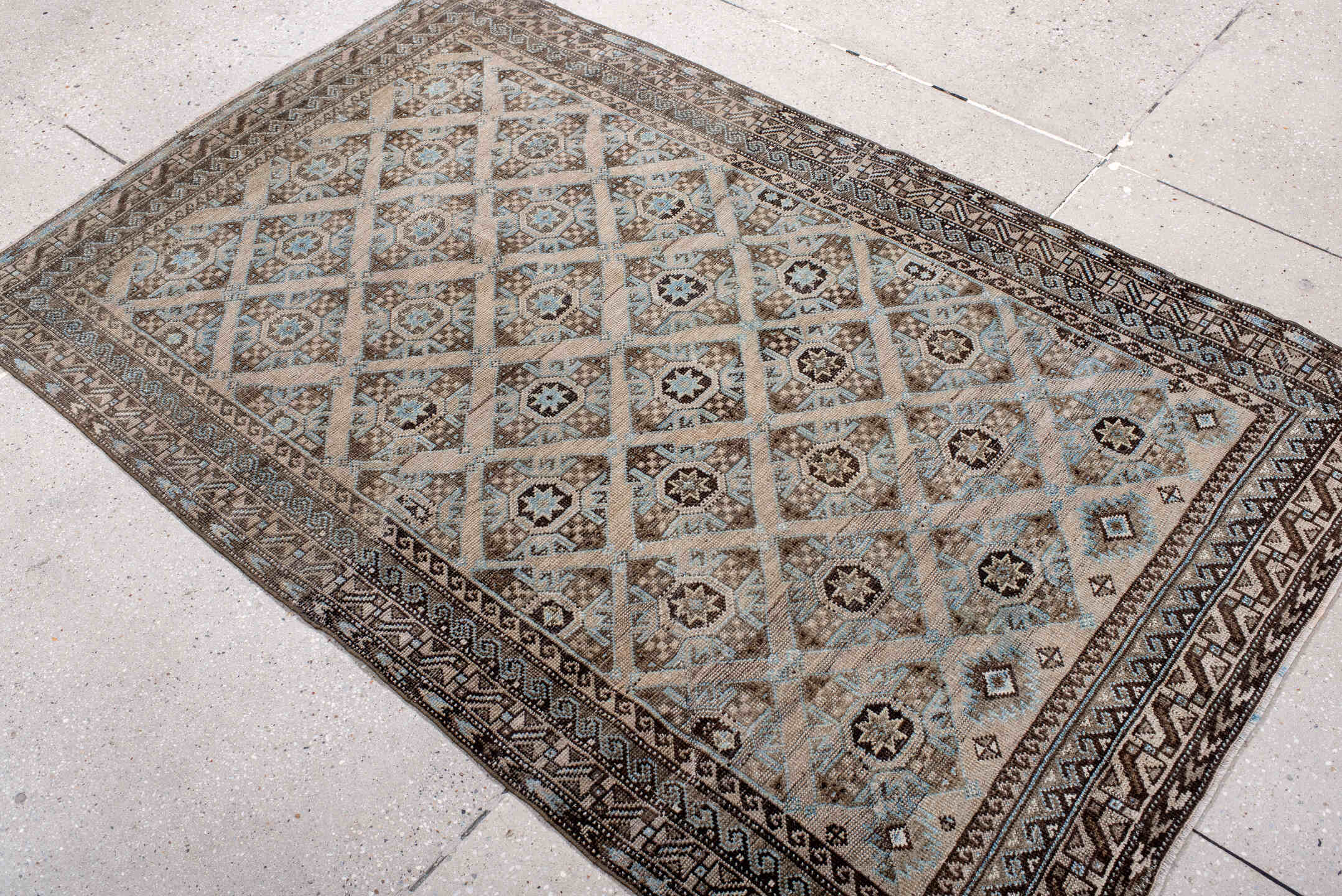 3' x 5' one-of-a-kind handmade antique Belouch small size rug. Color palette: brown, camel, ivory, sky blue, taupe, charcoal