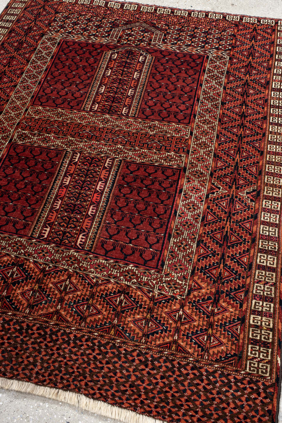 4' x 5' one-of-a-kind handmade antique Torkaman small size rug. Color palette: rust, crimson, ivory, black, terra cotta