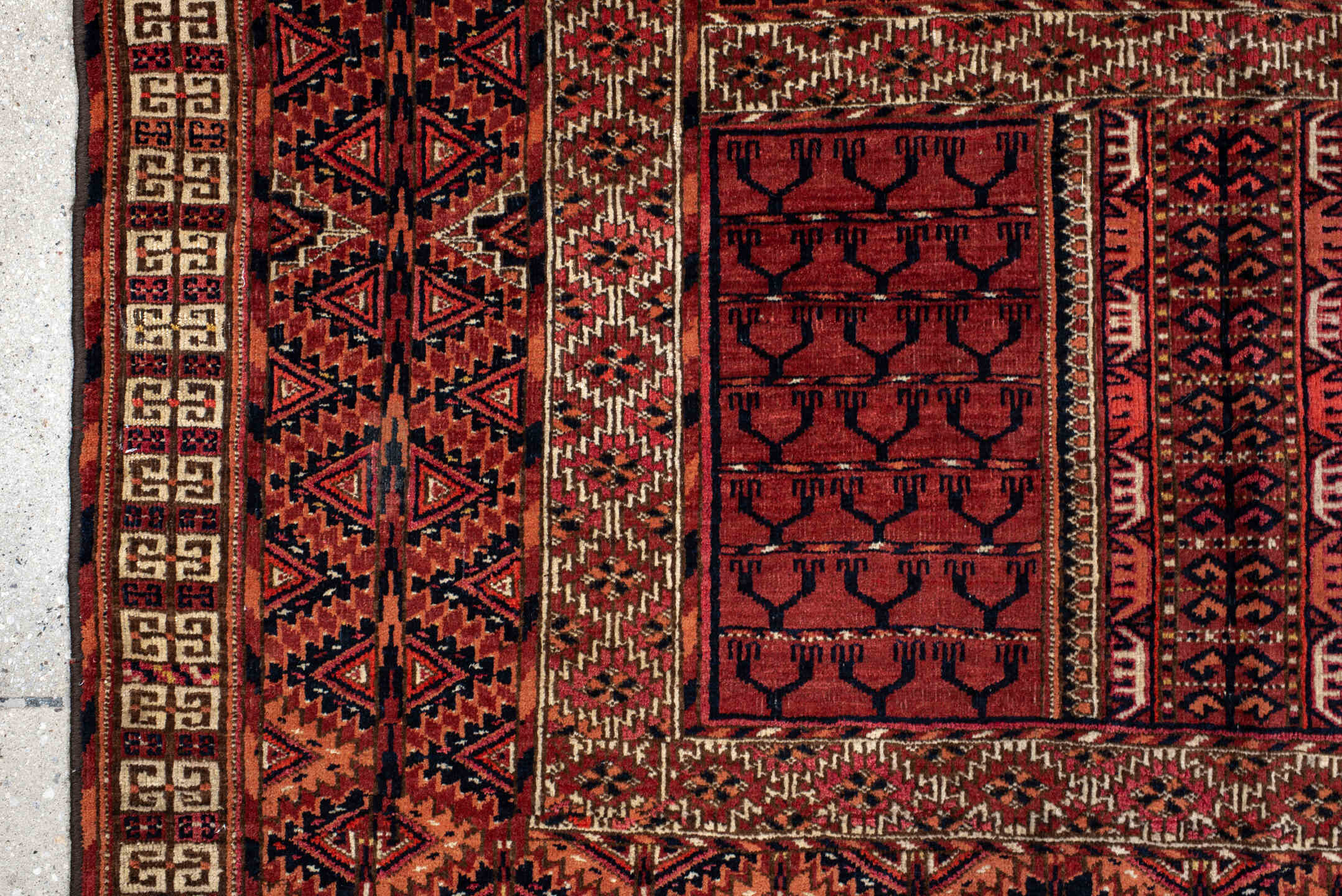 4' x 5' one-of-a-kind handmade antique Torkaman small size rug. Color palette: rust, crimson, ivory, black, terra cotta