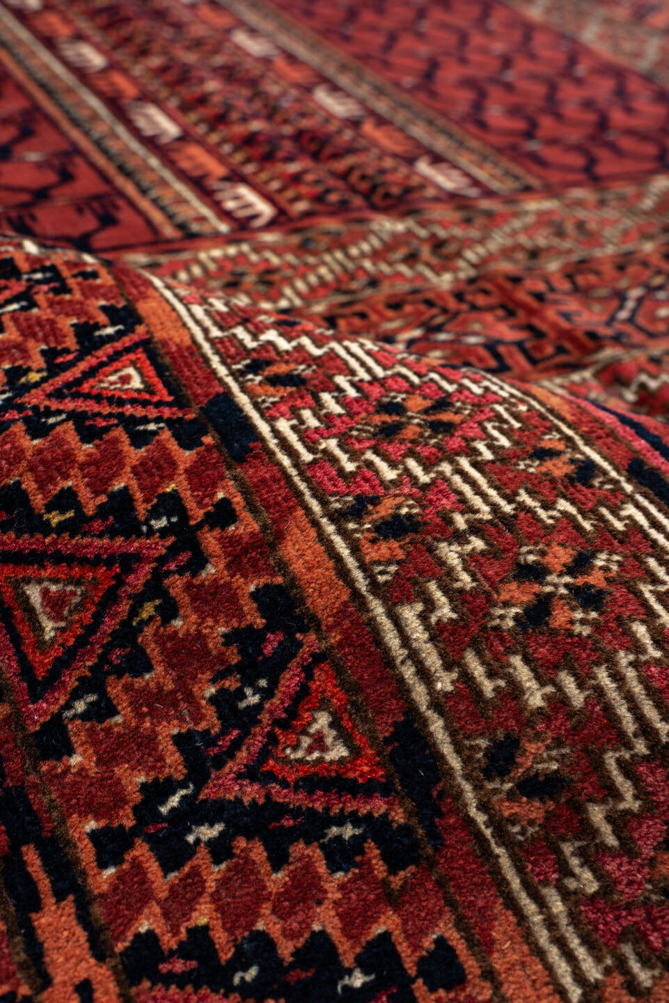 4' x 5' one-of-a-kind handmade antique Torkaman small size rug. Color palette: rust, crimson, ivory, black, terra cotta