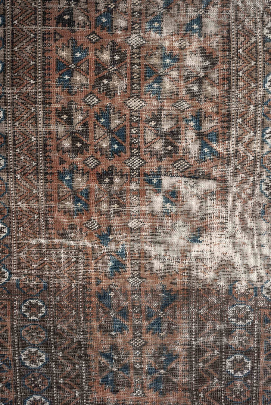 2' x 4' one-of-a-kind handmade antique Belouch small size rug. Color palette: rust, indigo, ivory, charcoal, camel, taupe