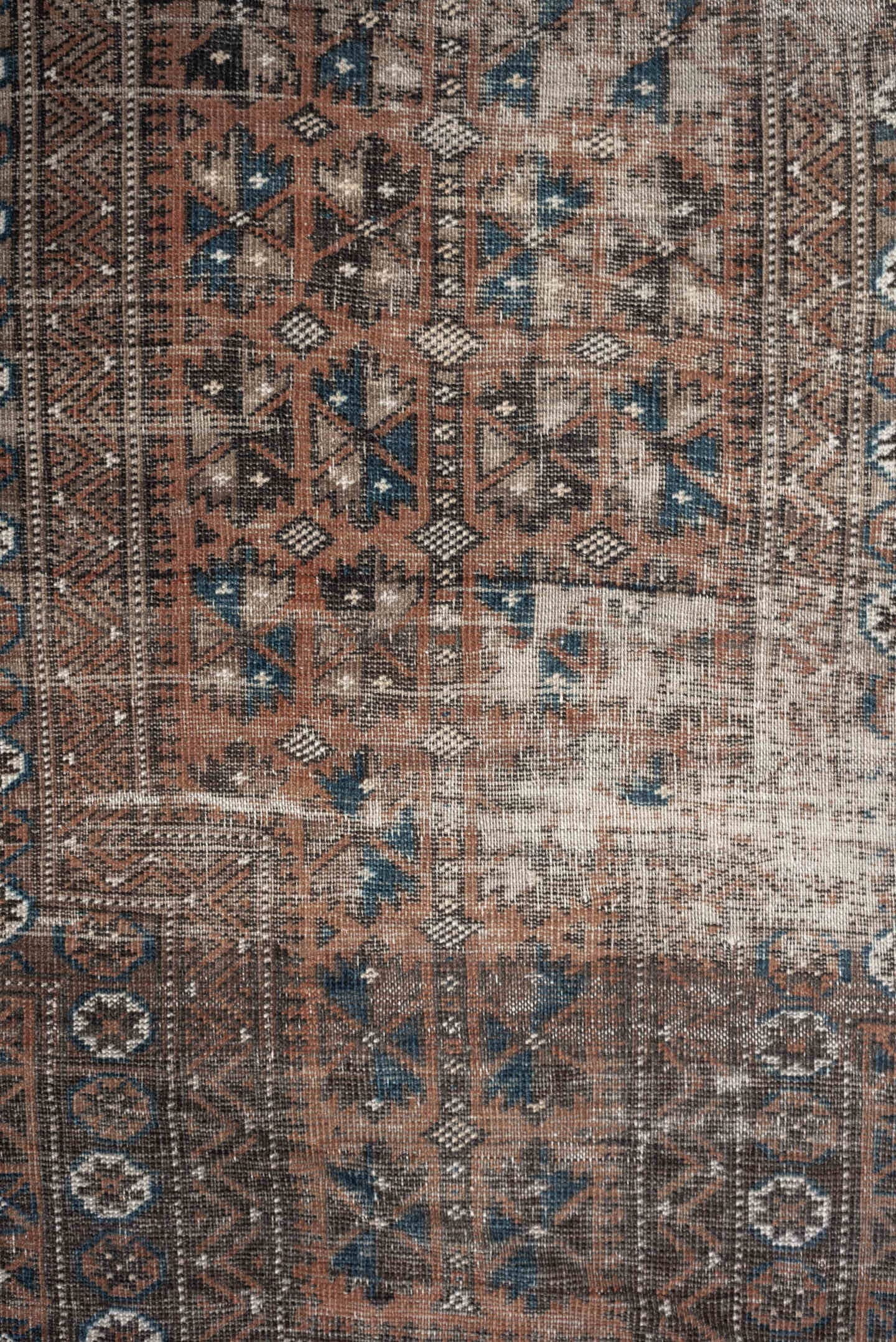 2' x 4' one-of-a-kind handmade antique Belouch small size rug. Color palette: rust, indigo, ivory, charcoal, camel, taupe
