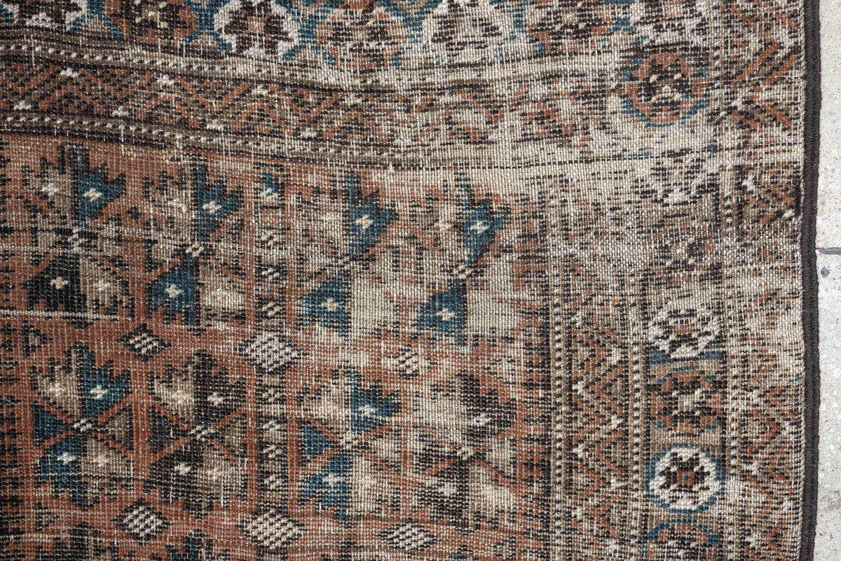 2' x 4' one-of-a-kind handmade antique Belouch small size rug. Color palette: rust, indigo, ivory, charcoal, camel, taupe