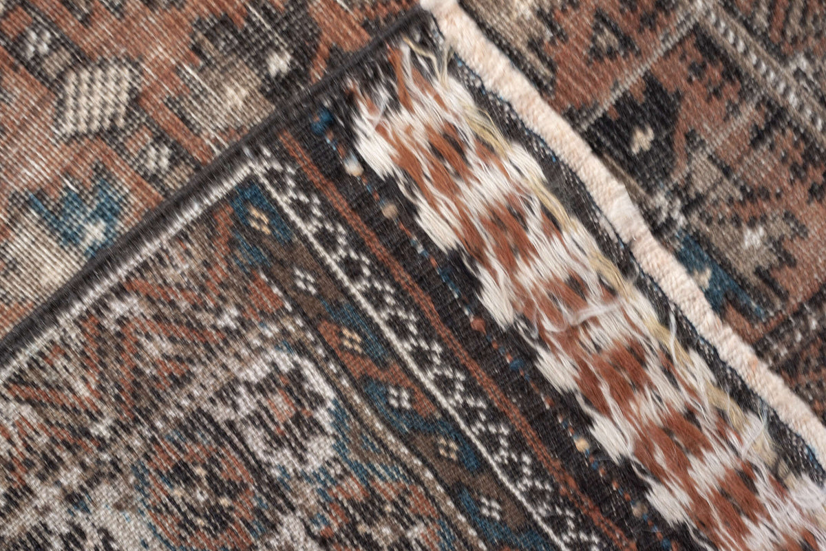 2' x 4' one-of-a-kind handmade antique Belouch small size rug. Color palette: rust, indigo, ivory, charcoal, camel, taupe