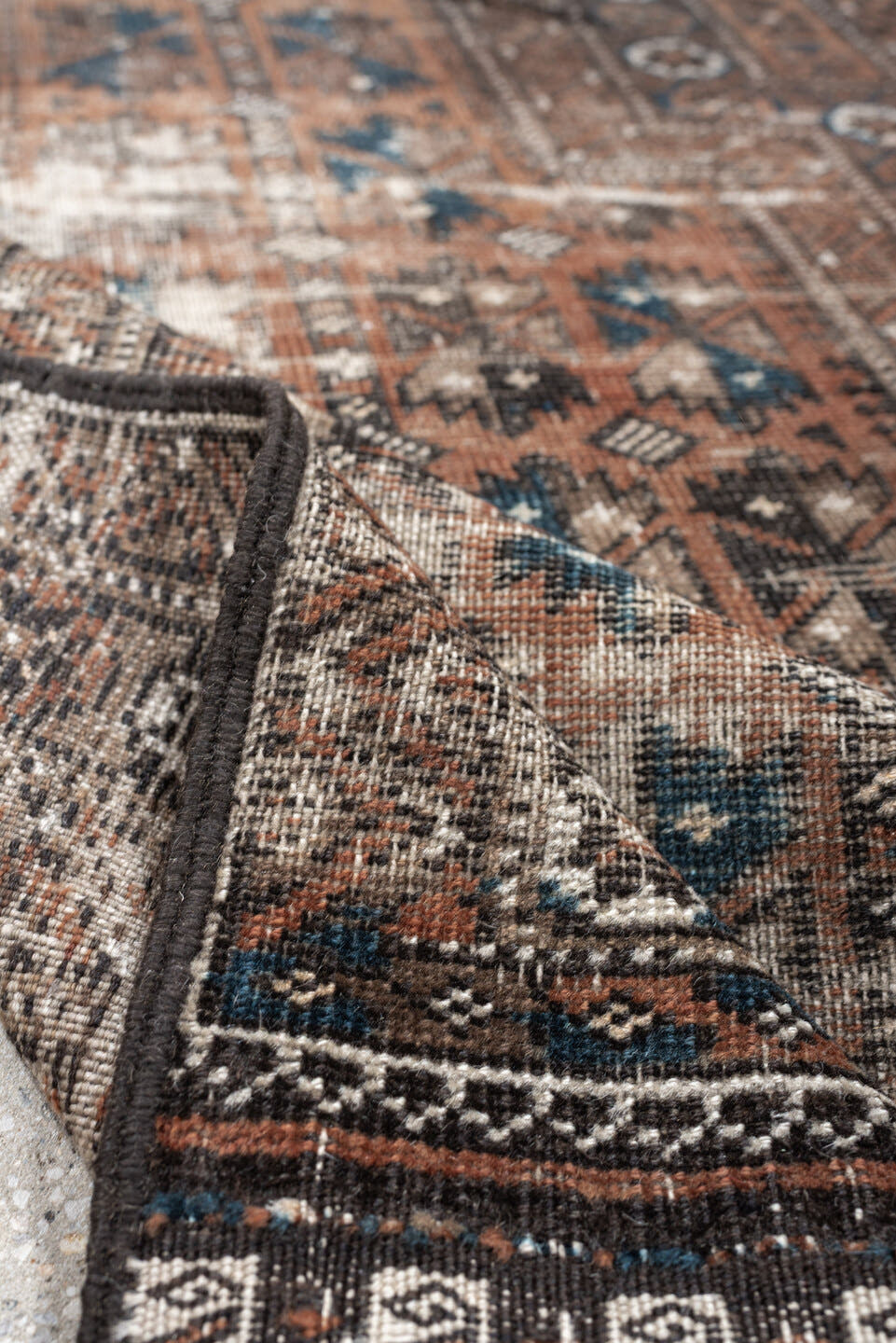 2' x 4' one-of-a-kind handmade antique Belouch small size rug. Color palette: rust, indigo, ivory, charcoal, camel, taupe