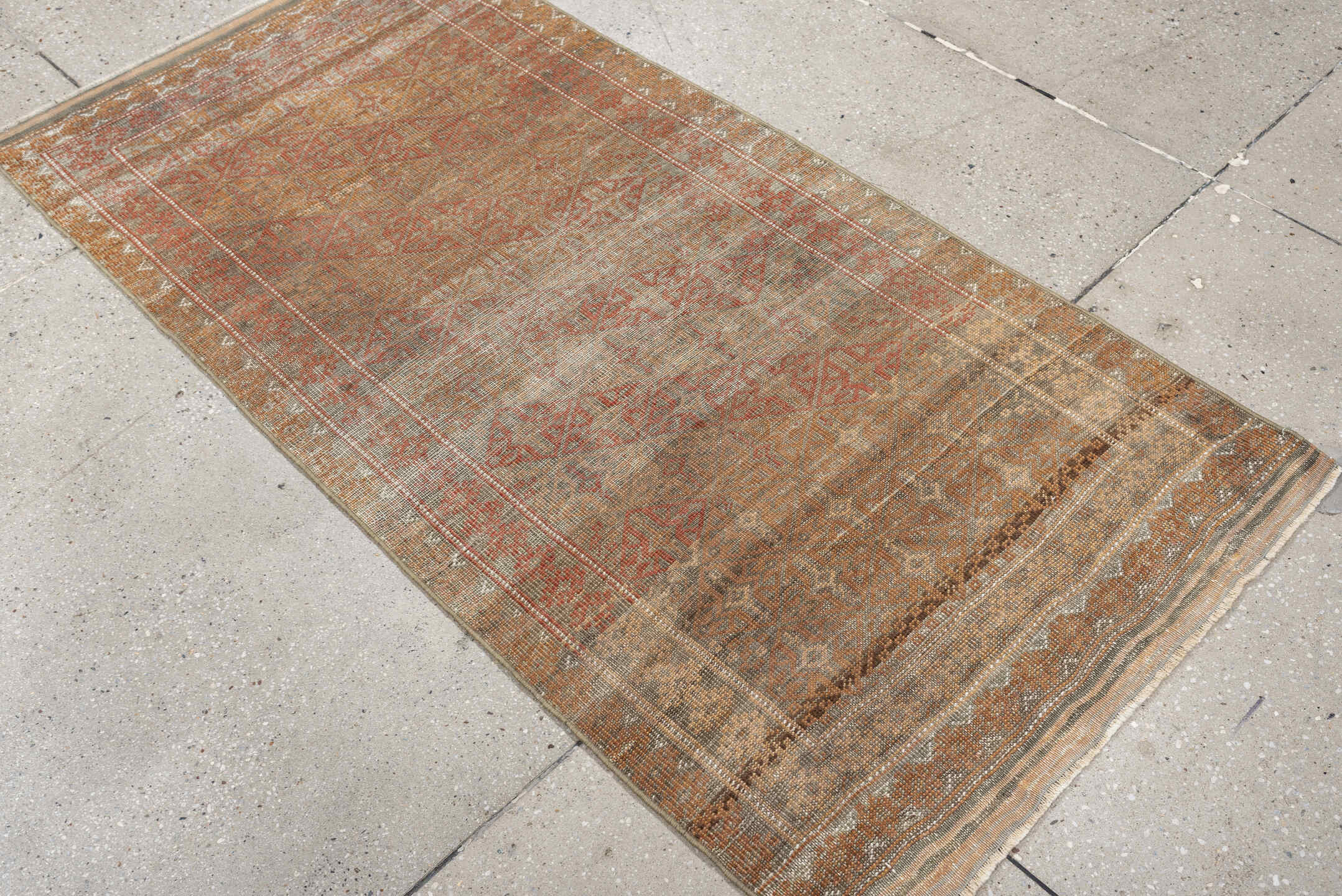 2' x 5' one-of-a-kind handmade antique Belouch small size rug. Color palette: taupe, rust, ivory, camel, brown, charcoal