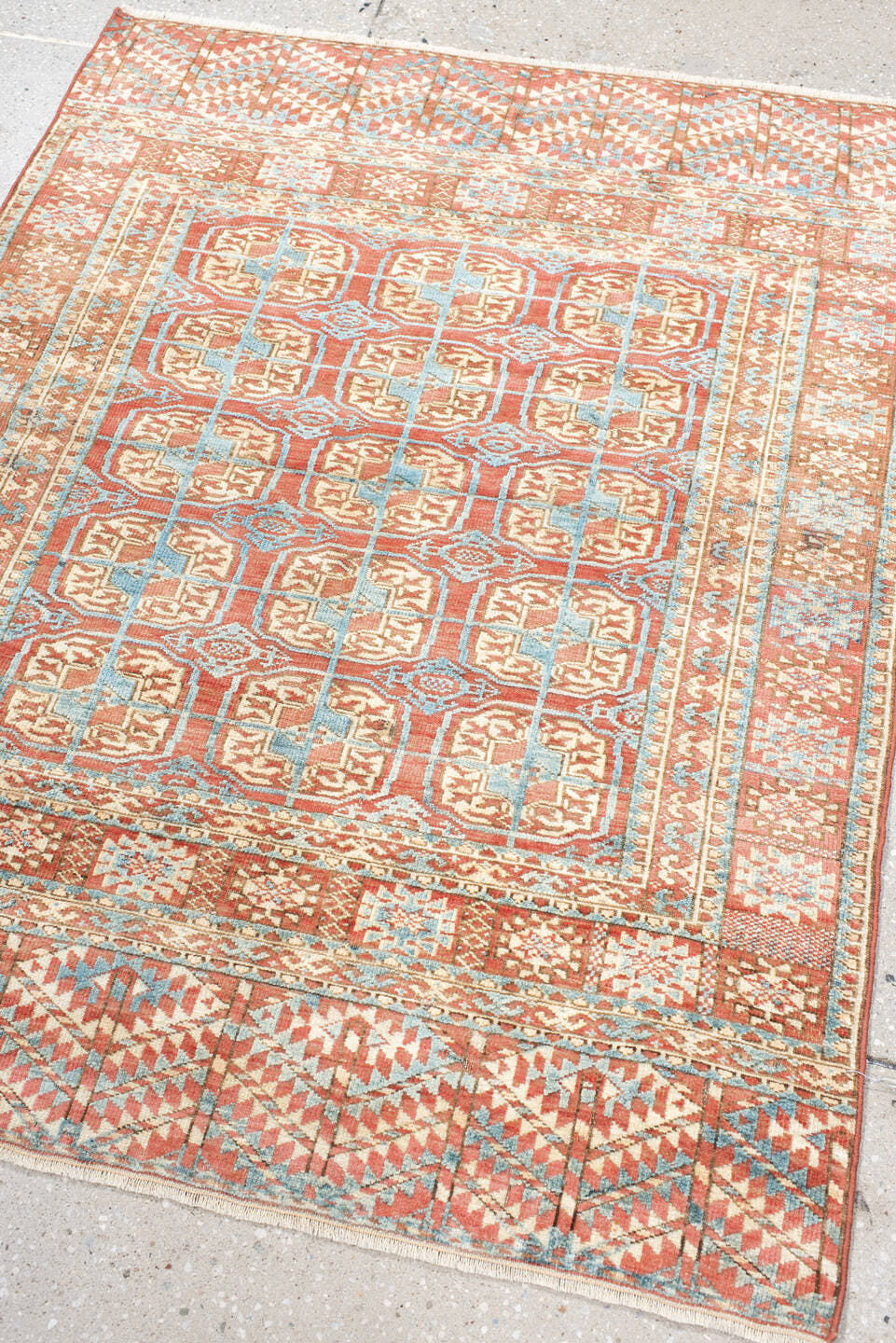 3' x 4' one-of-a-kind handmade antique Bokara small size rug. Color palette: coral, ivory, sky_blue, rust, camel, terracotta